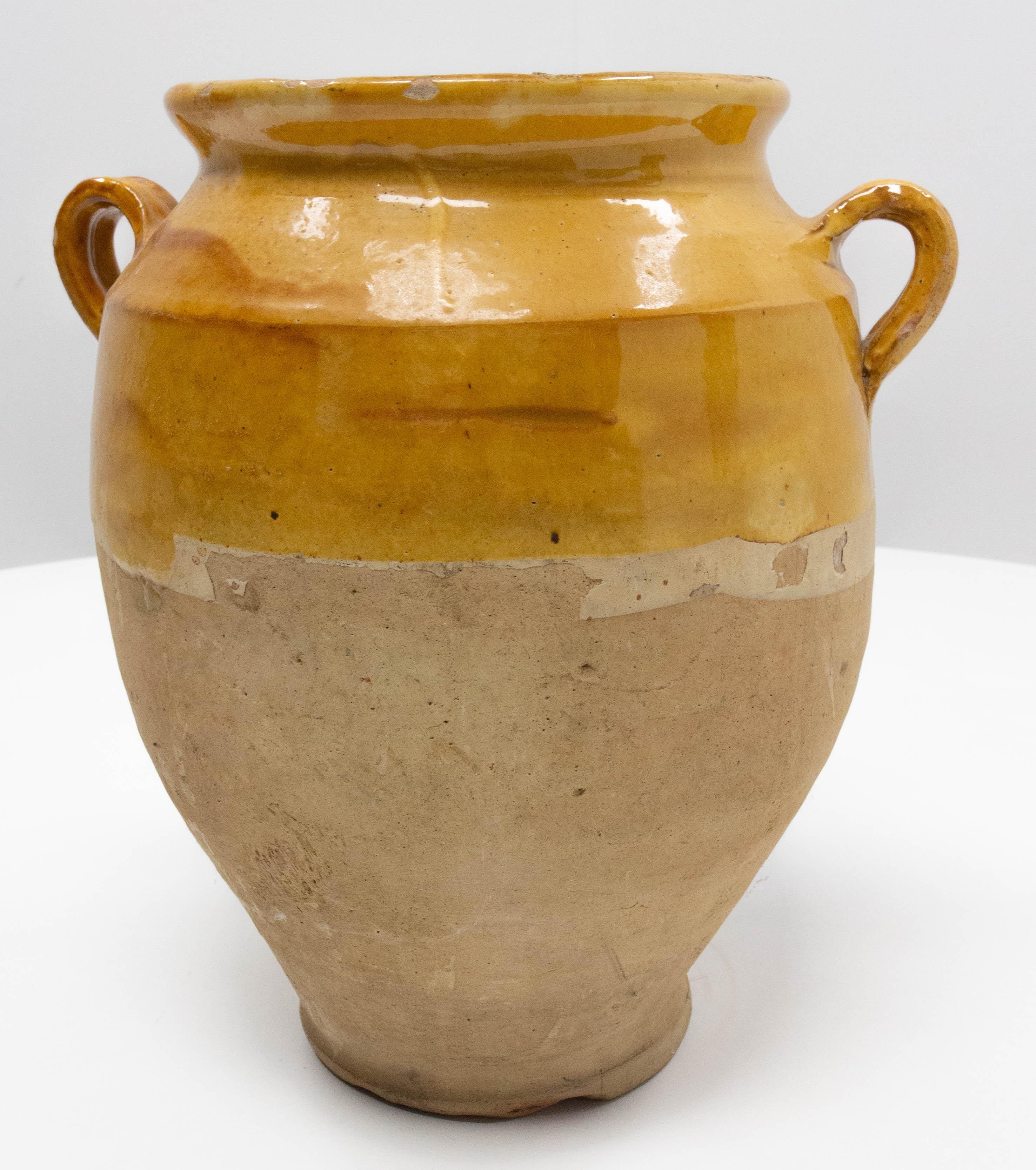 French terracotta confit pot
Traditional large earthenware pottery confit pot from South West France with yellow glaze
This vessel was used from the 19th to the mid-20th century to conserve food
Very decorative
Good patina and bright yellow