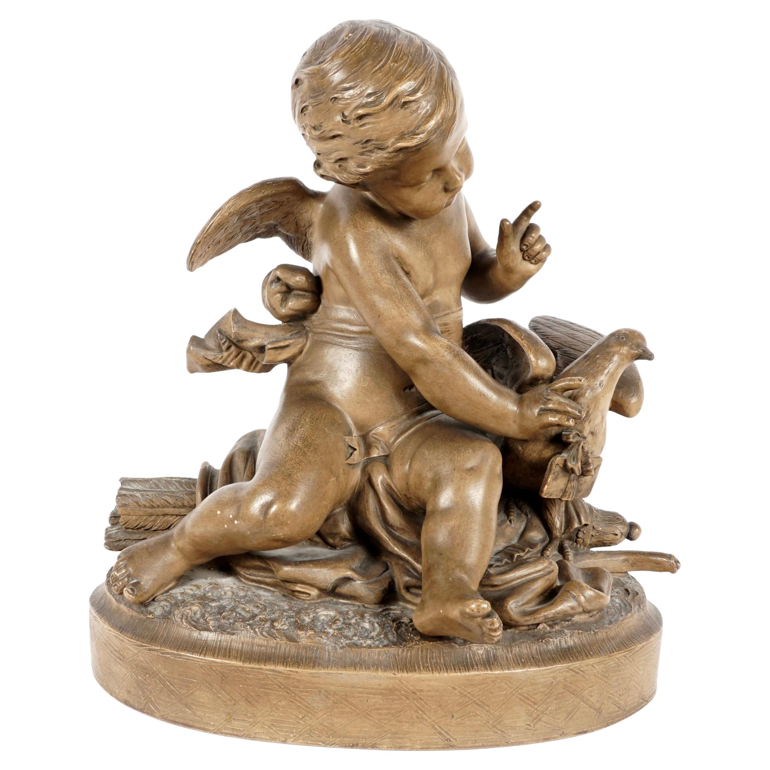 Gruppo figurativo in terracotta francese di Cherubino con colomba