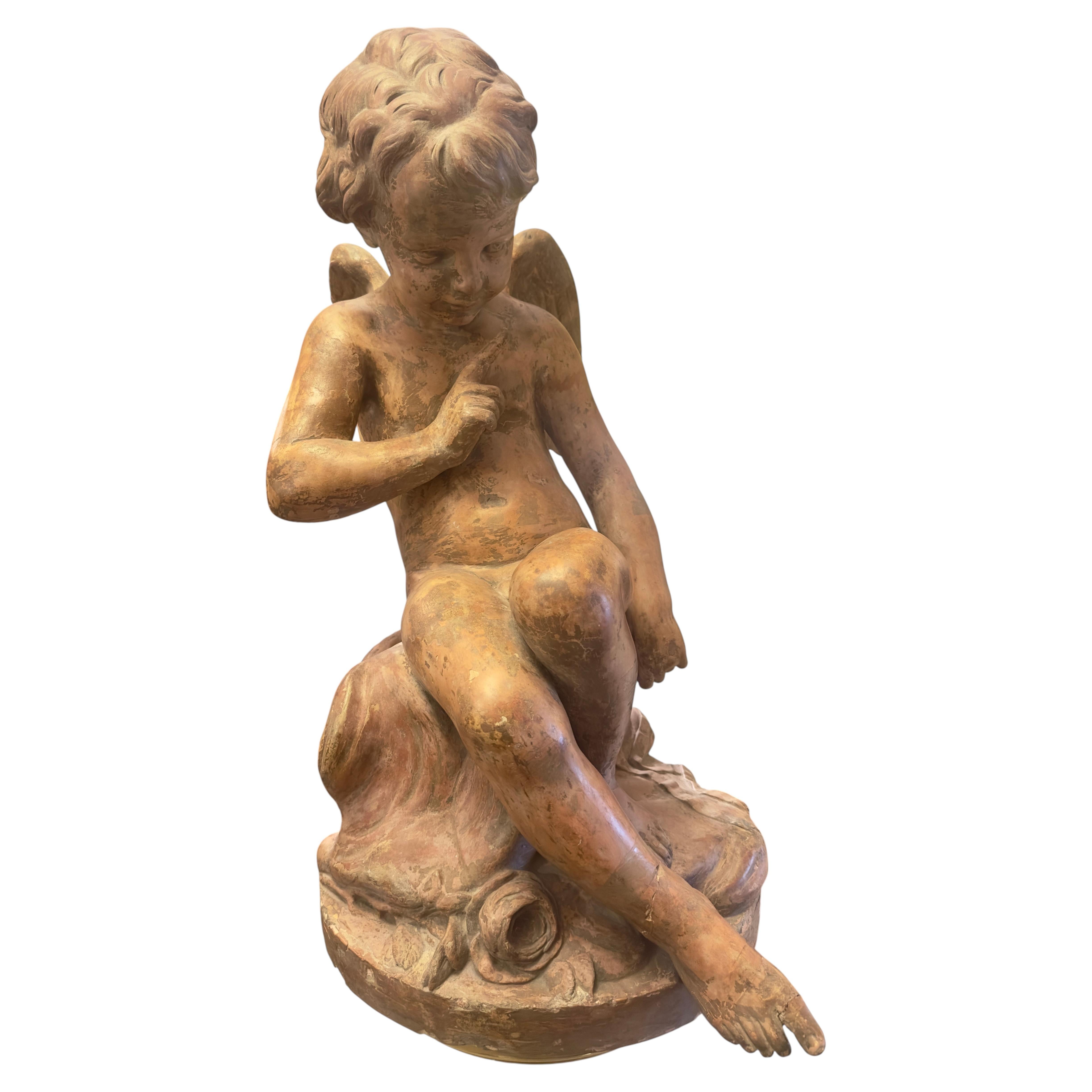 Figura di Cupido in terracotta francese su modello di Etienne Maurice Falconet