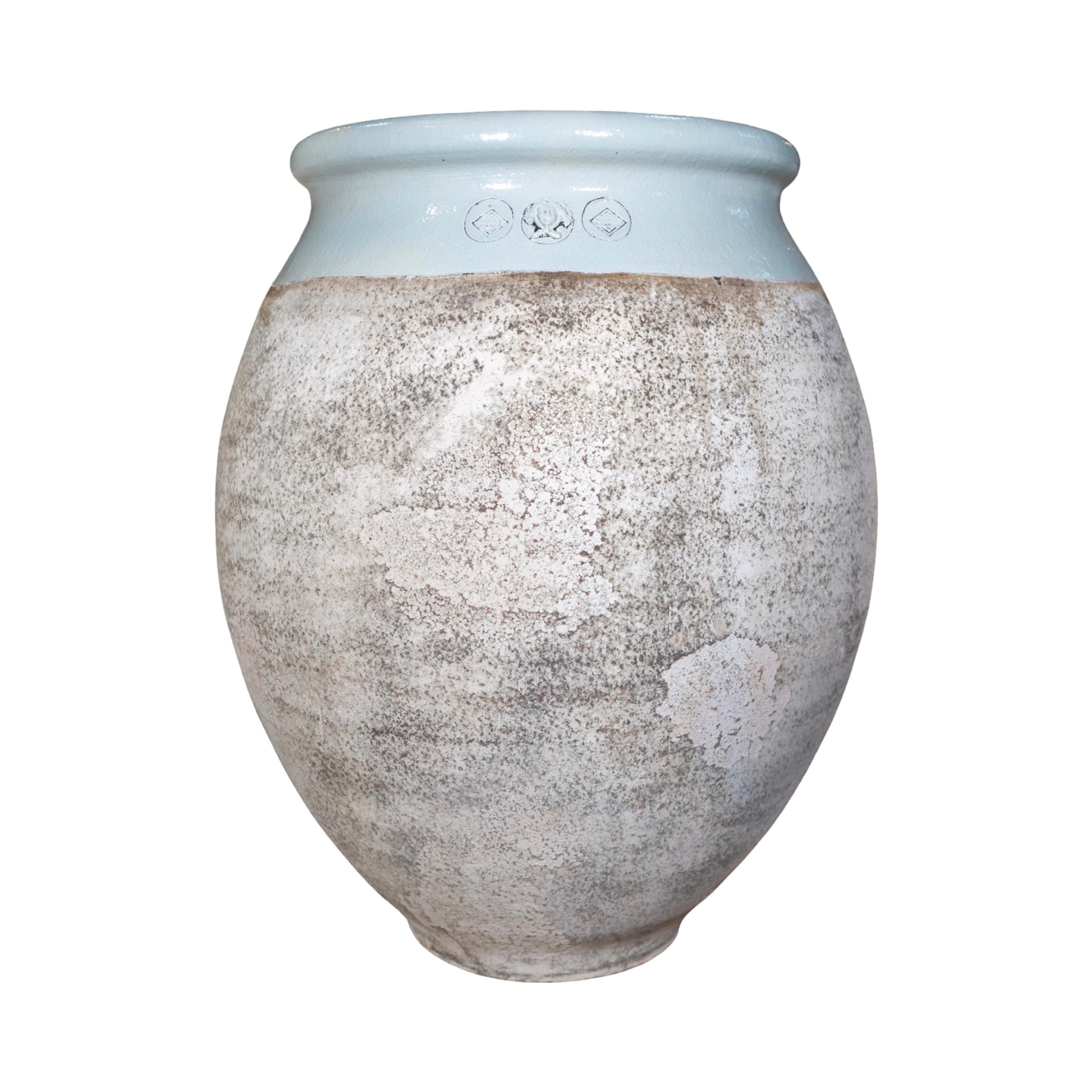 This French Terracotta Glazed Planter is a contemporary piece, handmade in France, with a unique glazed baby blue finish and a textured surface for a beautifully aged look. Crafted from genuine terracotta, it features a carved medusa motif in the