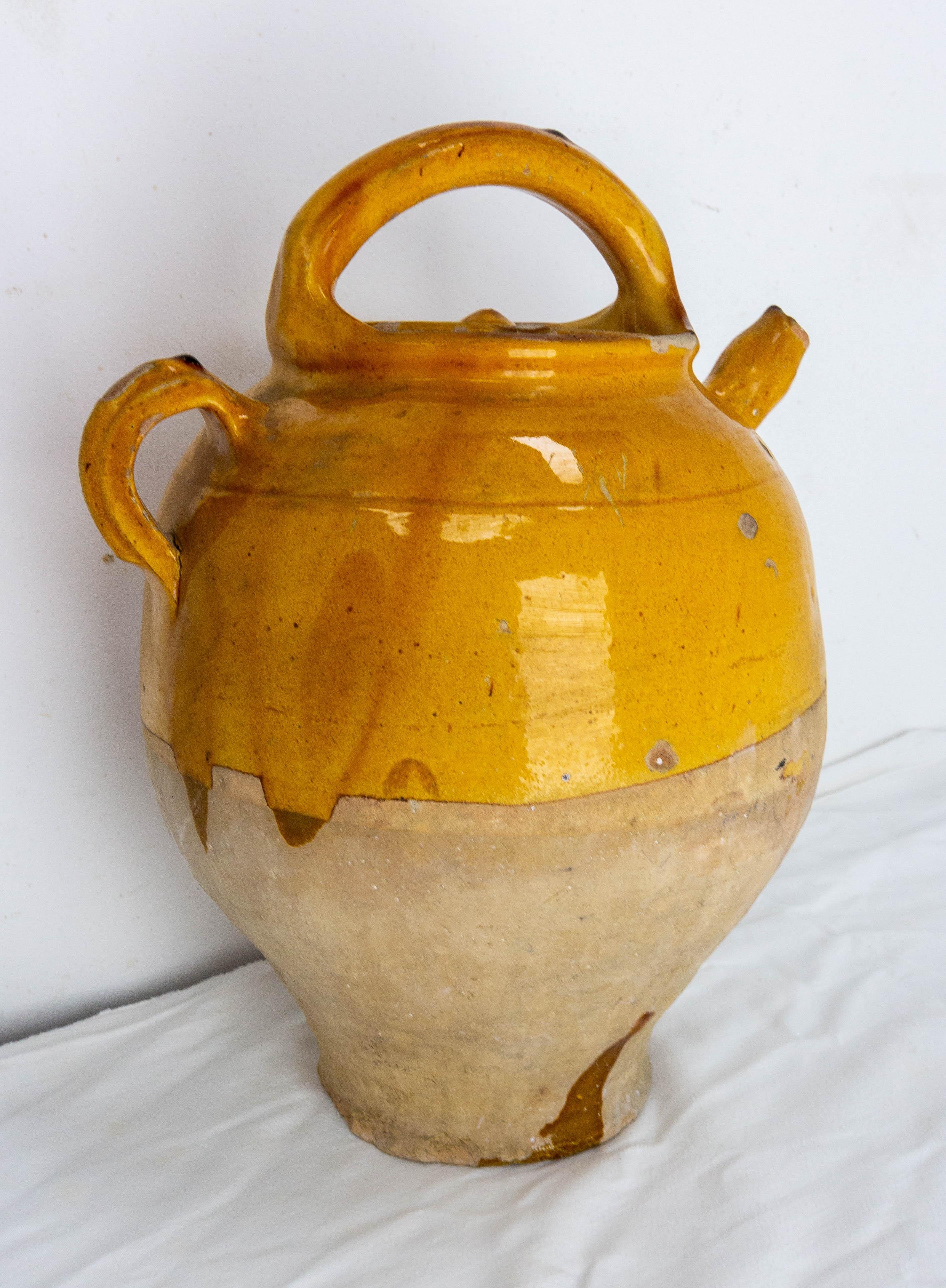 Terracotta jug with yellow glaze. This kind of pitcher was used to keep the water fresh, at a time when electricity did not exist.
Very decorative.
Good patina and bright yellow color.
Good antique condition with a small splinter on the collar,