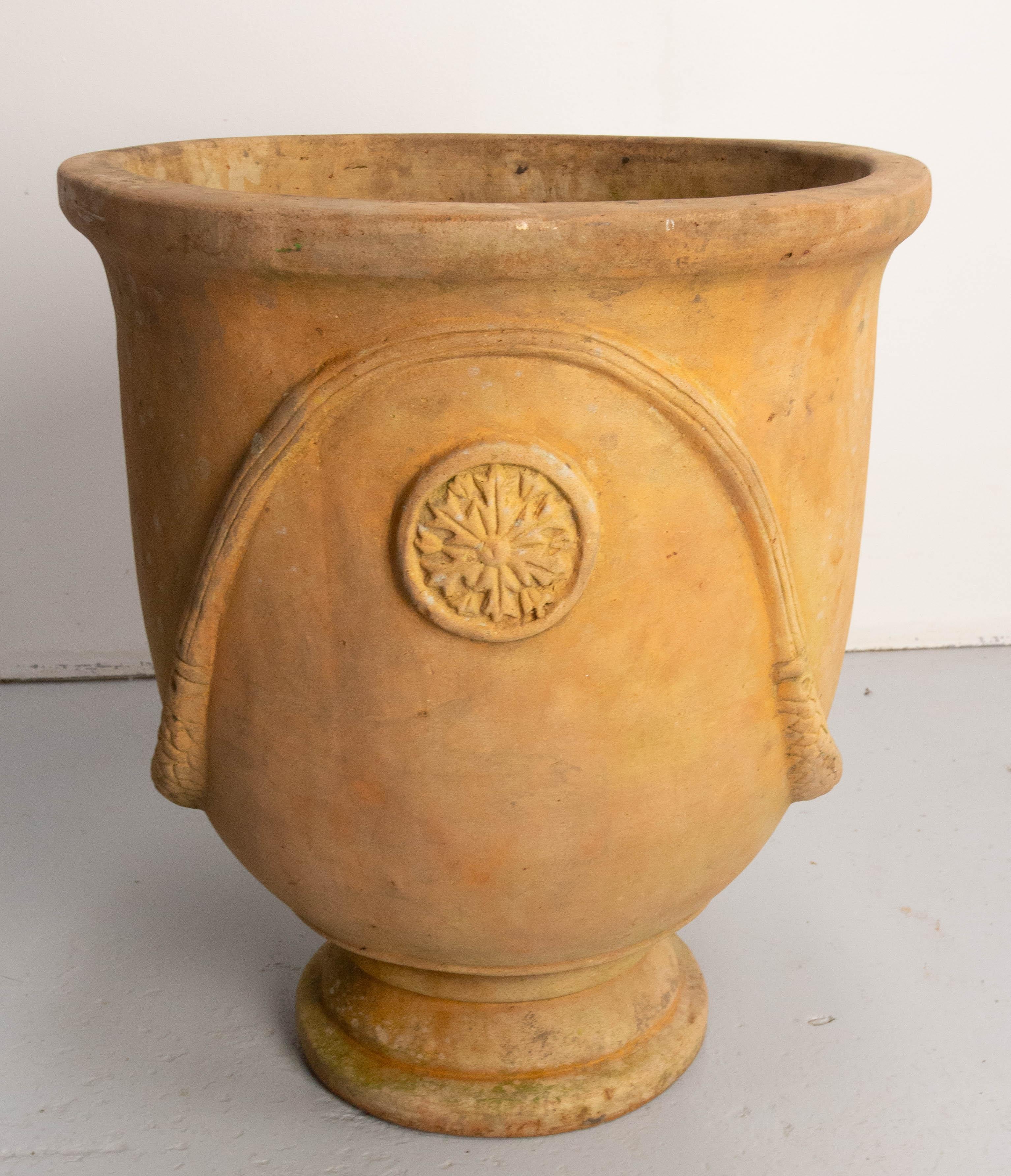 This terracotta planter is made is the Anduze style from the Boisset brothers manufacture. 
This type of vase has been made by the Boisset family at Anduze in the South of France for four centuries. A Cévennes potter was inspired by Medicis vases at