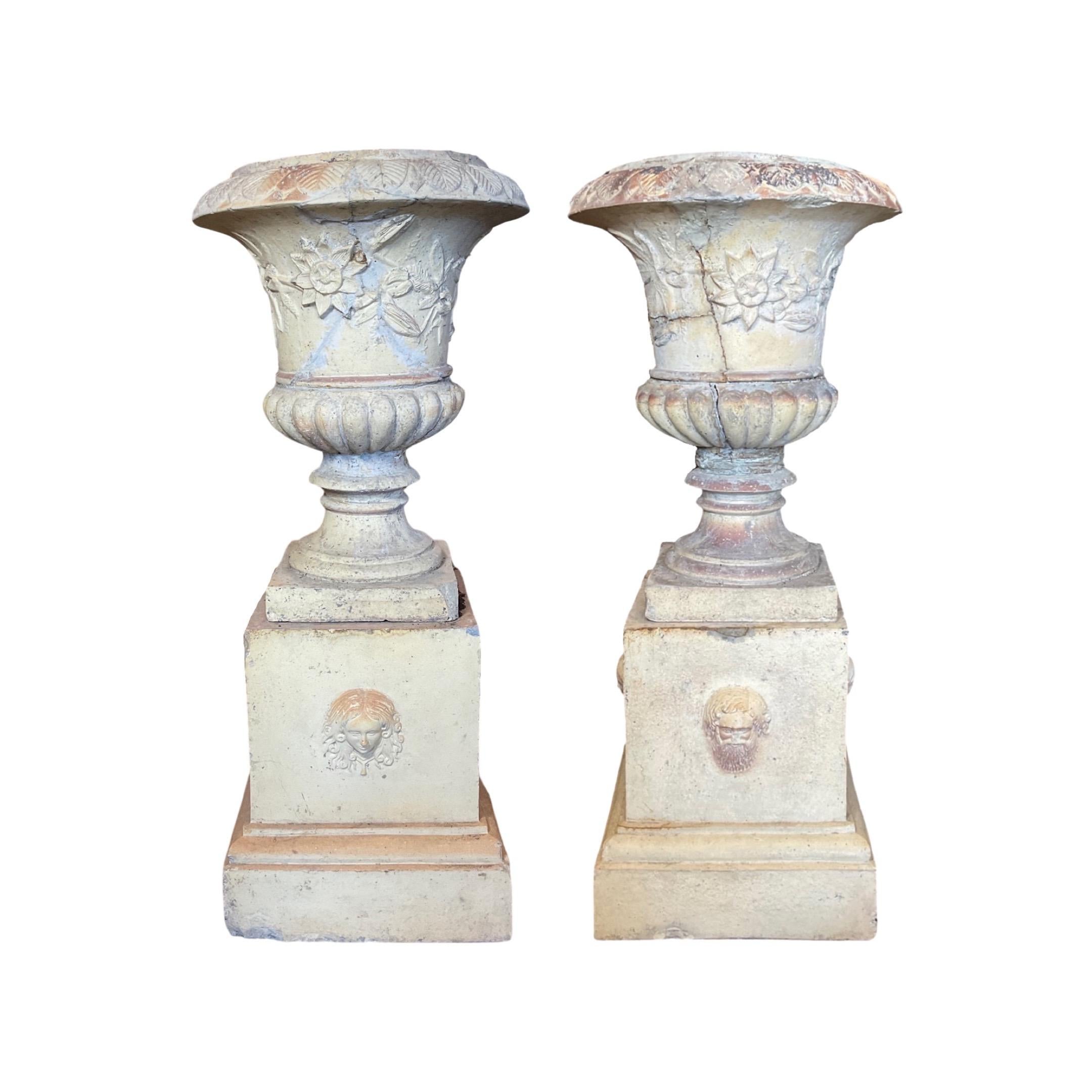 This pair of French Terracotta Planters comes with both the planters and the base, giving you a complete look for your garden. Crafted in 1890, they are made out of terracotta for a durable yet elegant design. Perfect for a flower or herb garden,