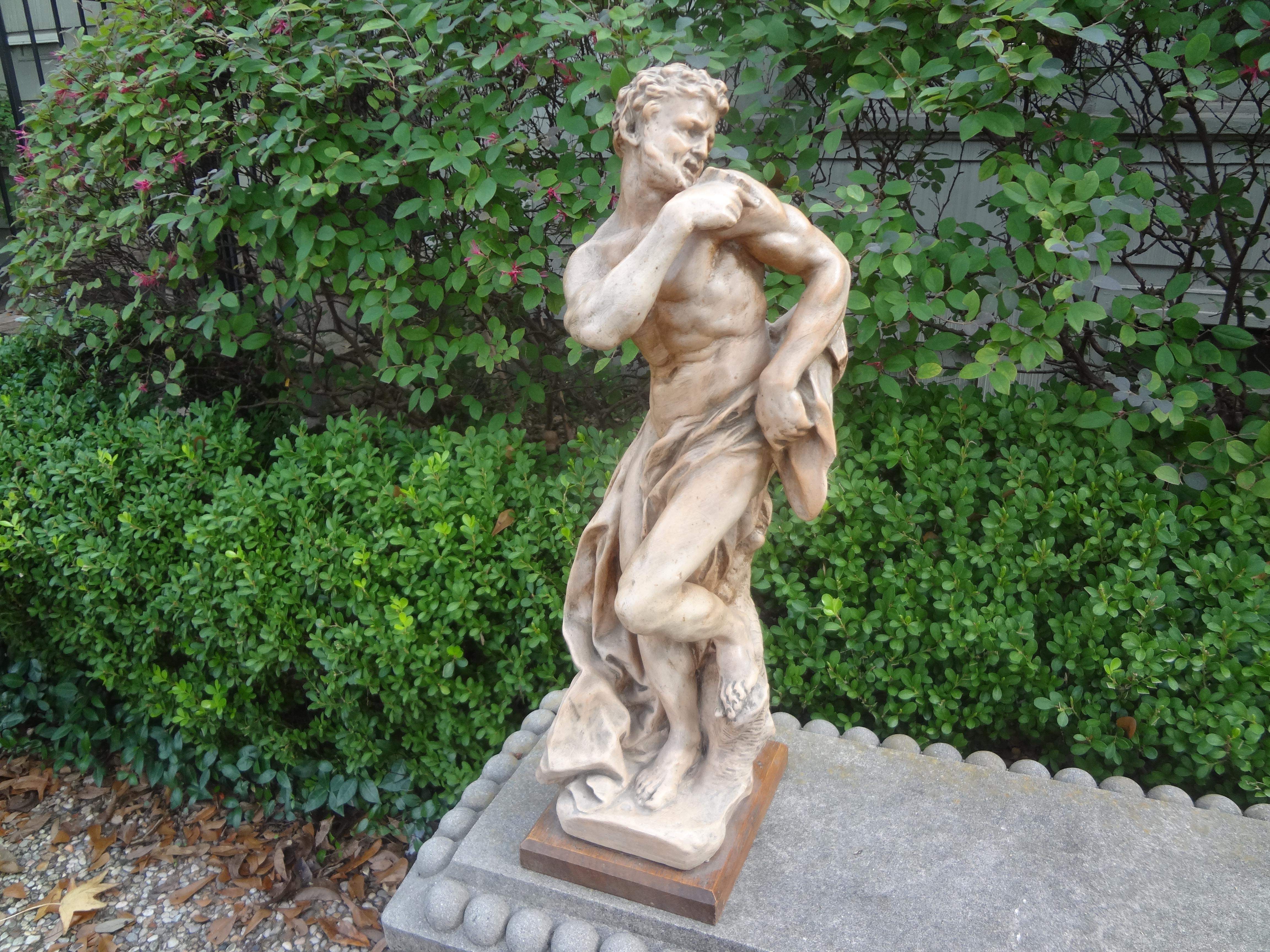 French terracotta sculpture of a classical male.
This stunning French terra cotta sculpture of a classical Roman male is expertly executed with beautiful draping and
 mounted on a wood base.
