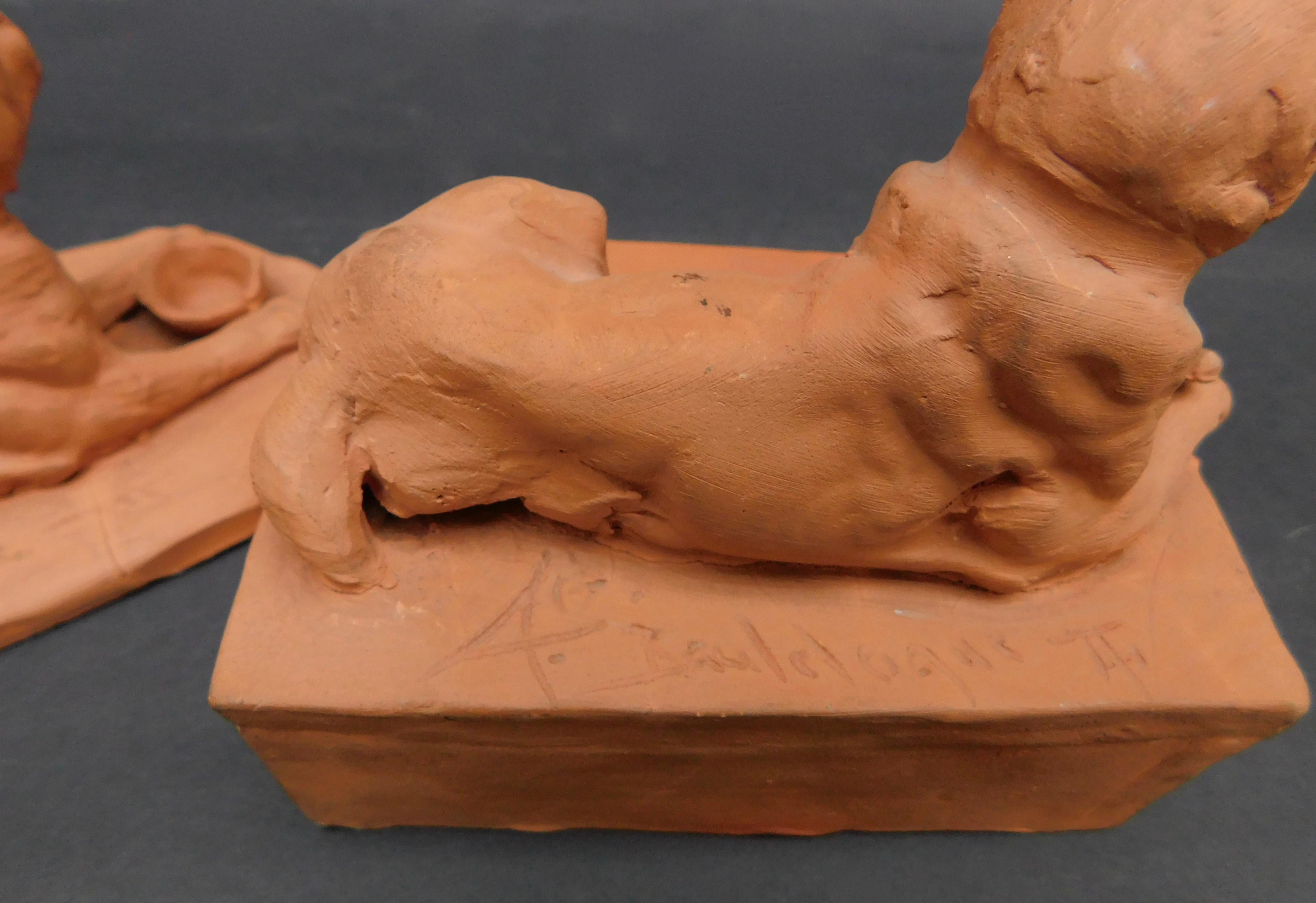 Hand-sculpted terracotta studies for bronze castings of Mastiff dogs, circa 1930. Each sculpture is signed on the back 