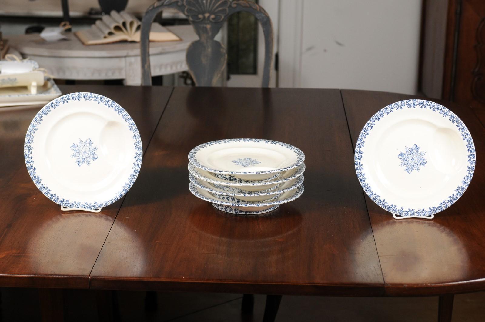 Six Terre de Fer blue and white asparagus plates from the 19th century, with foliage and fruit decor, priced and sold individually. Born in France during the 19th century, each of these plates features a blue foliage and fruit décor standing out