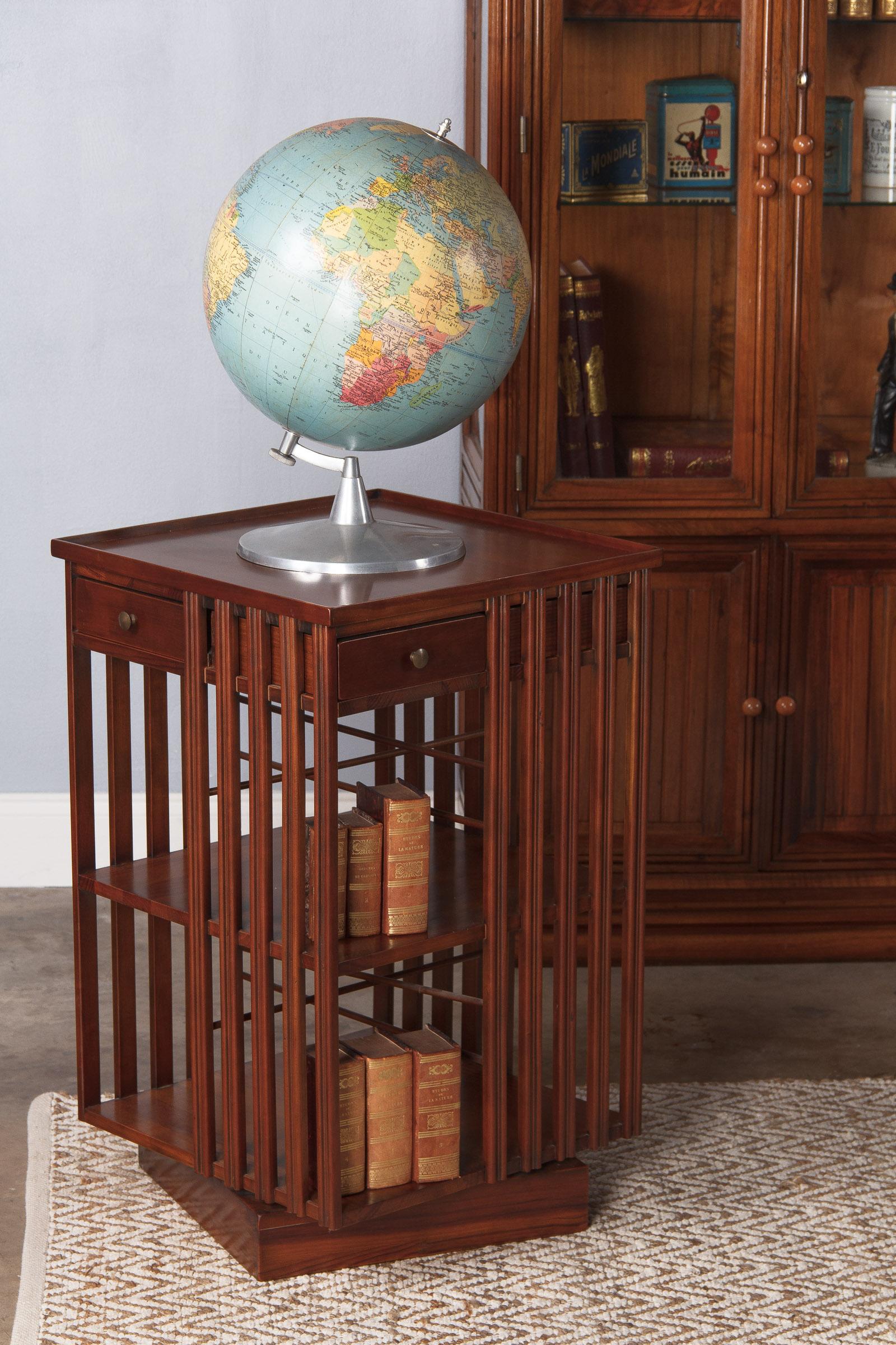 A 1960s terrestrial globe made in France by Cartes Taride, Paris. The papier mâché sphere rotates on an aluminium support.