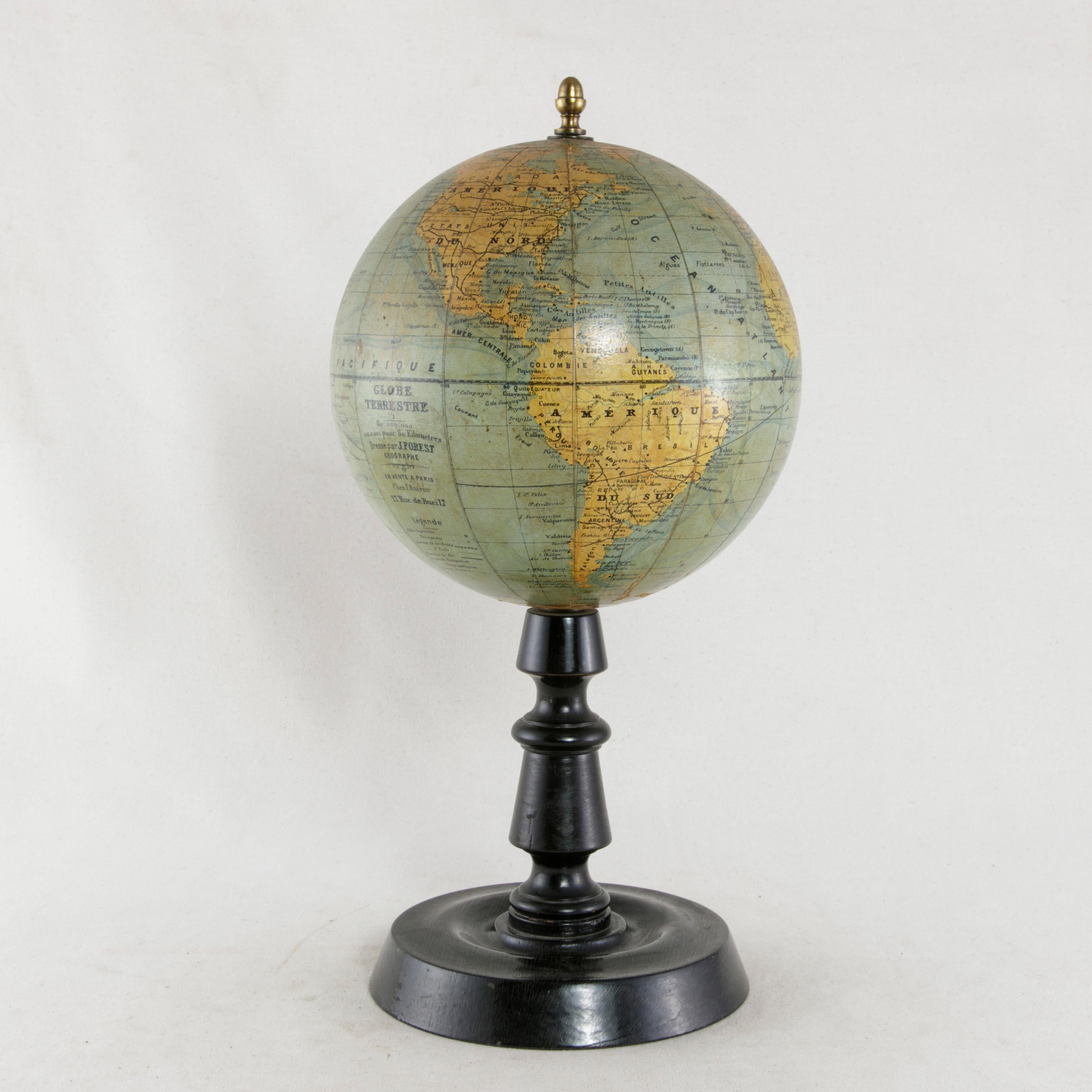 This papier mâché terrestrial globe from the early 20th century was edited by the renowned French cartographer J. Forest and features not only physical borders, but also ocean currents and train line routes of the period. A piece of world history,