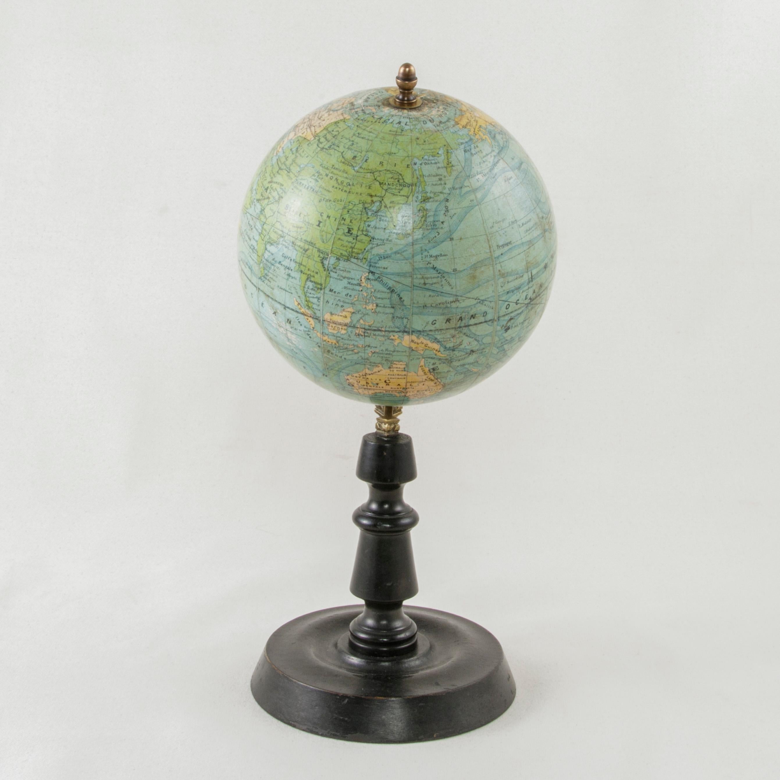 This papier mâché terrestrial globe from the early 20th century was edited by the renowned French cartographer J. Forest and features not only location names, but also ocean currents and train line routes of the period. A piece of world history, the