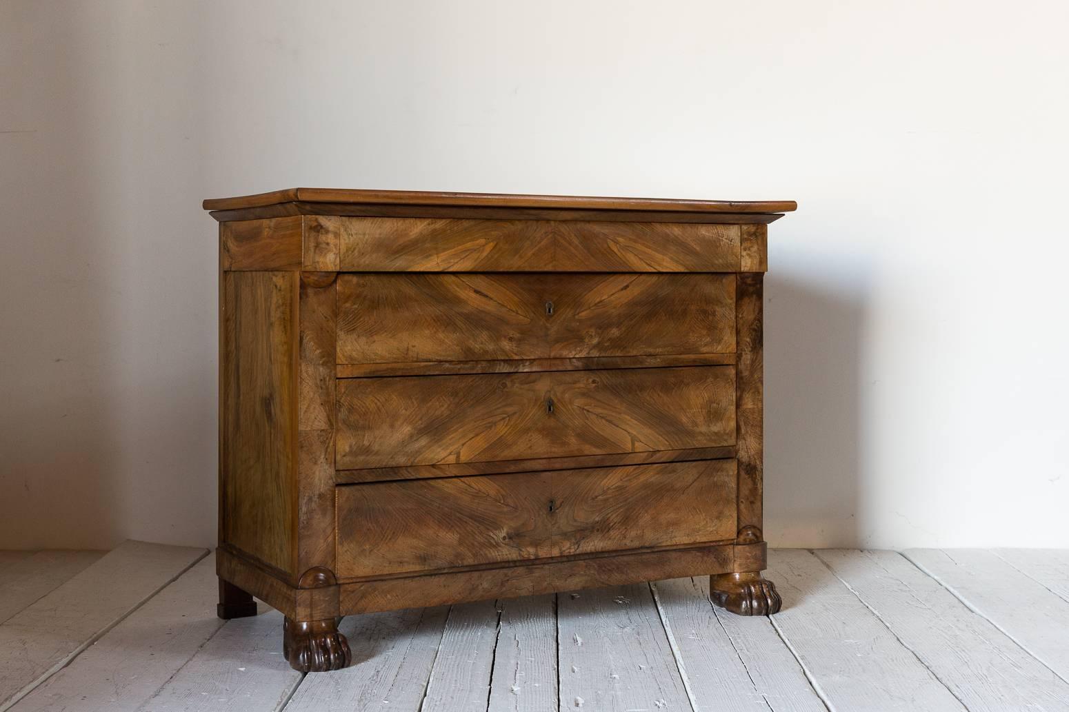 French three-drawer dresser with key hole details framed with beautiful mahogany marquetry details.