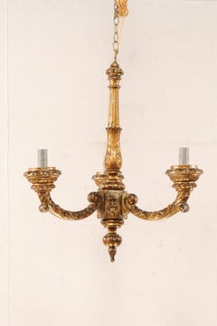 An Ornate French Carved Giltwood Three-Light Chandelier