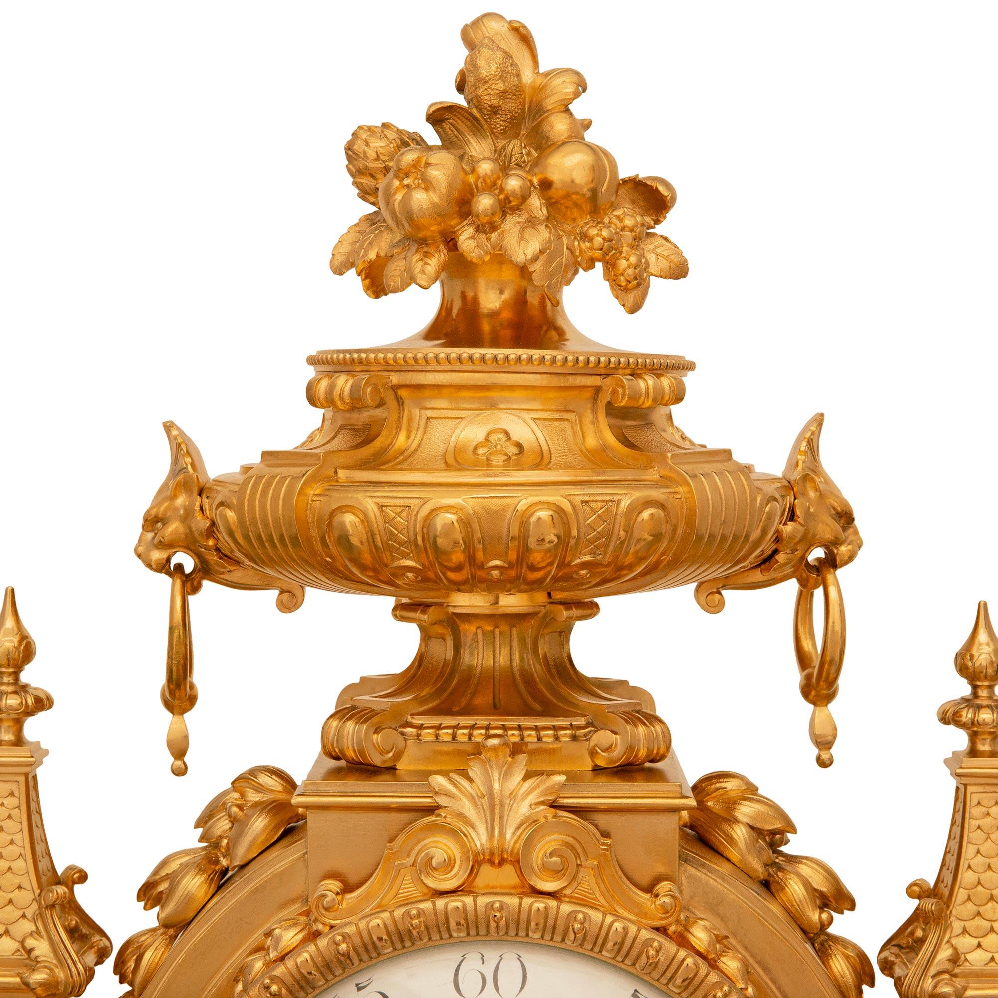 Ormolu French three piece garniture set, signed by the Lemerle-Charpentier foundry For Sale