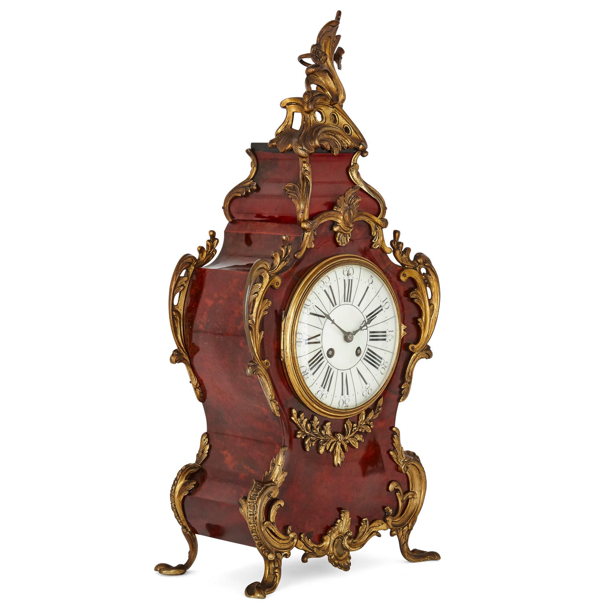 French three-piece tortoiseshell and gilt bronze clock set
French, late 19th century
Clock: Height 55cm, width 26cm, depth 15cm
Candelabra: Height 46cm, width 22cm, depth 20cm

Comprised of a mantel clock and a pair of flanking candelabra, this