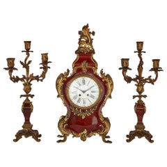 French Three-Piece Tortoiseshell and Gilt Bronze Clock Set