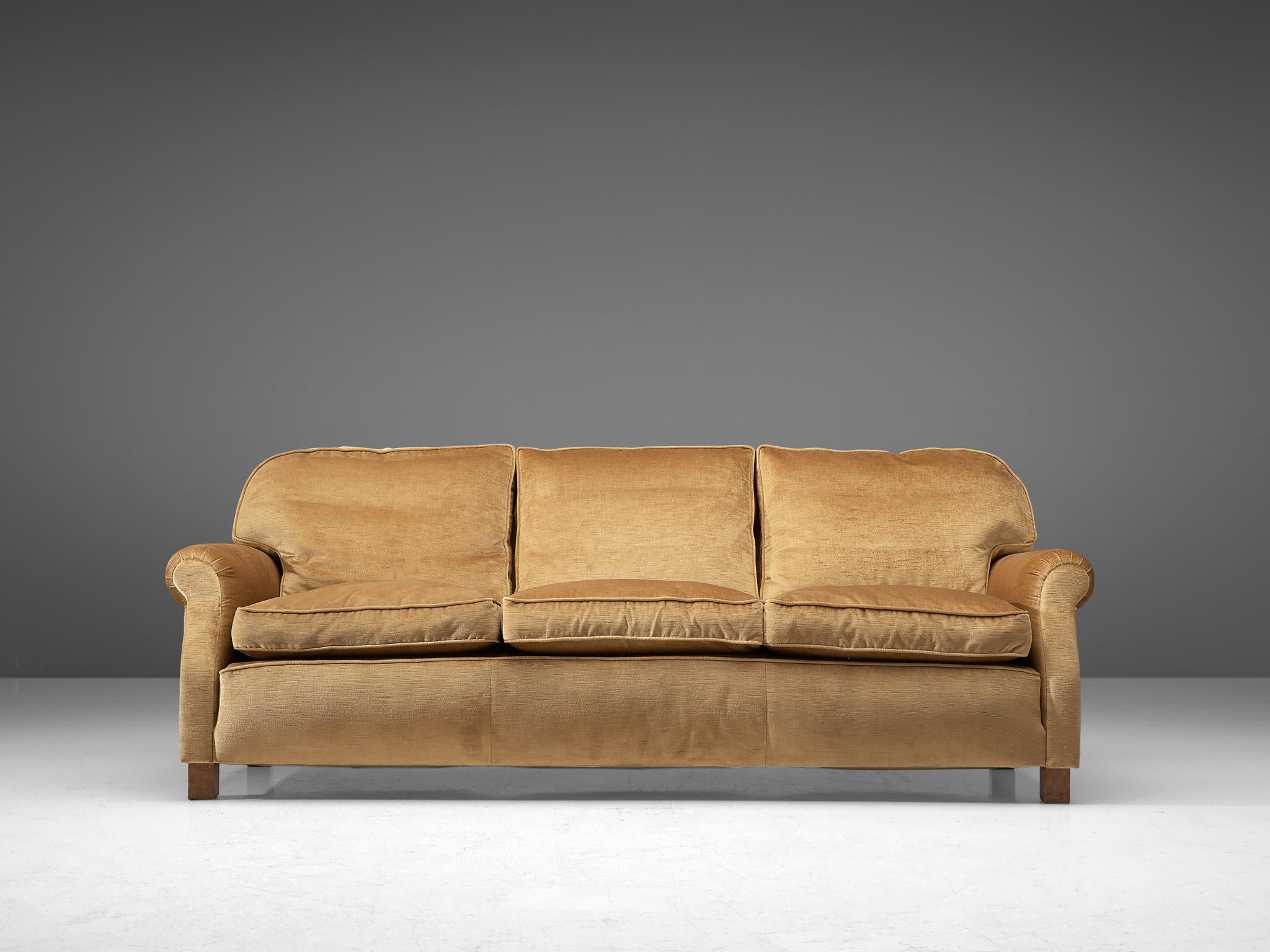 Three-seat sofa, velvet and wood, France, 1940s.

Grand and comfortable three-seat sofa in beige velvet upholstery. Very comfortable sofa that features a deep and thick seat with thick cushions. The armrests are curved and give the sofa and more
