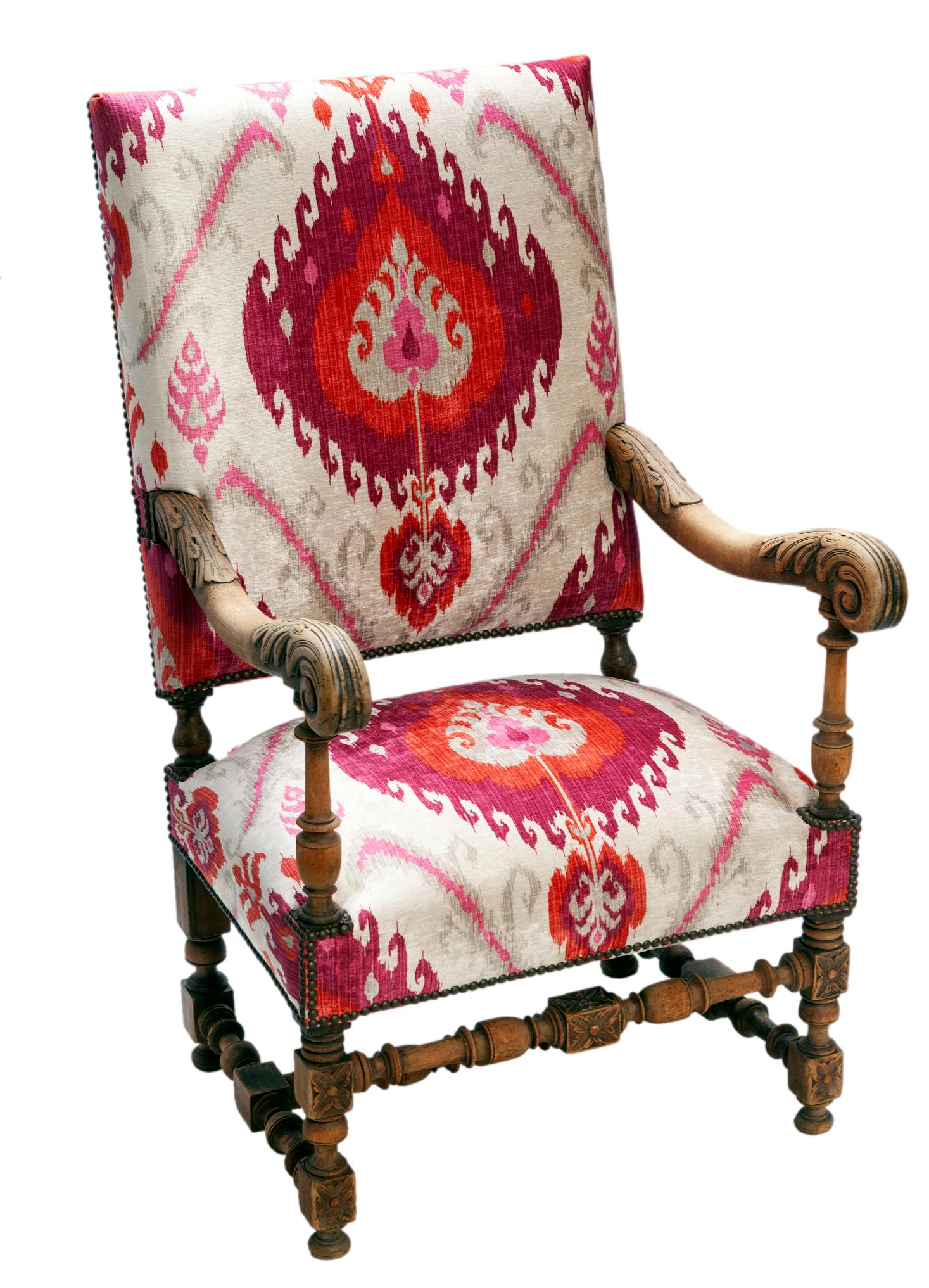 European entry throne chair with Ikat designer fabric, antique brass nail head detail & blanched hardwood in a natural finish.