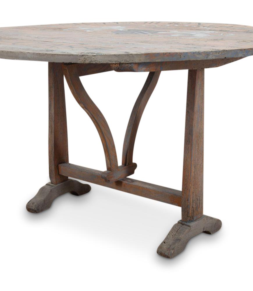 19th Century French tilt-top hand-painted table with a stunning plank top over an elegant twisting base.

This table has a real country feel only achievable after a century of time-worn wear which has achieved the gorgeous warm patina. Its original