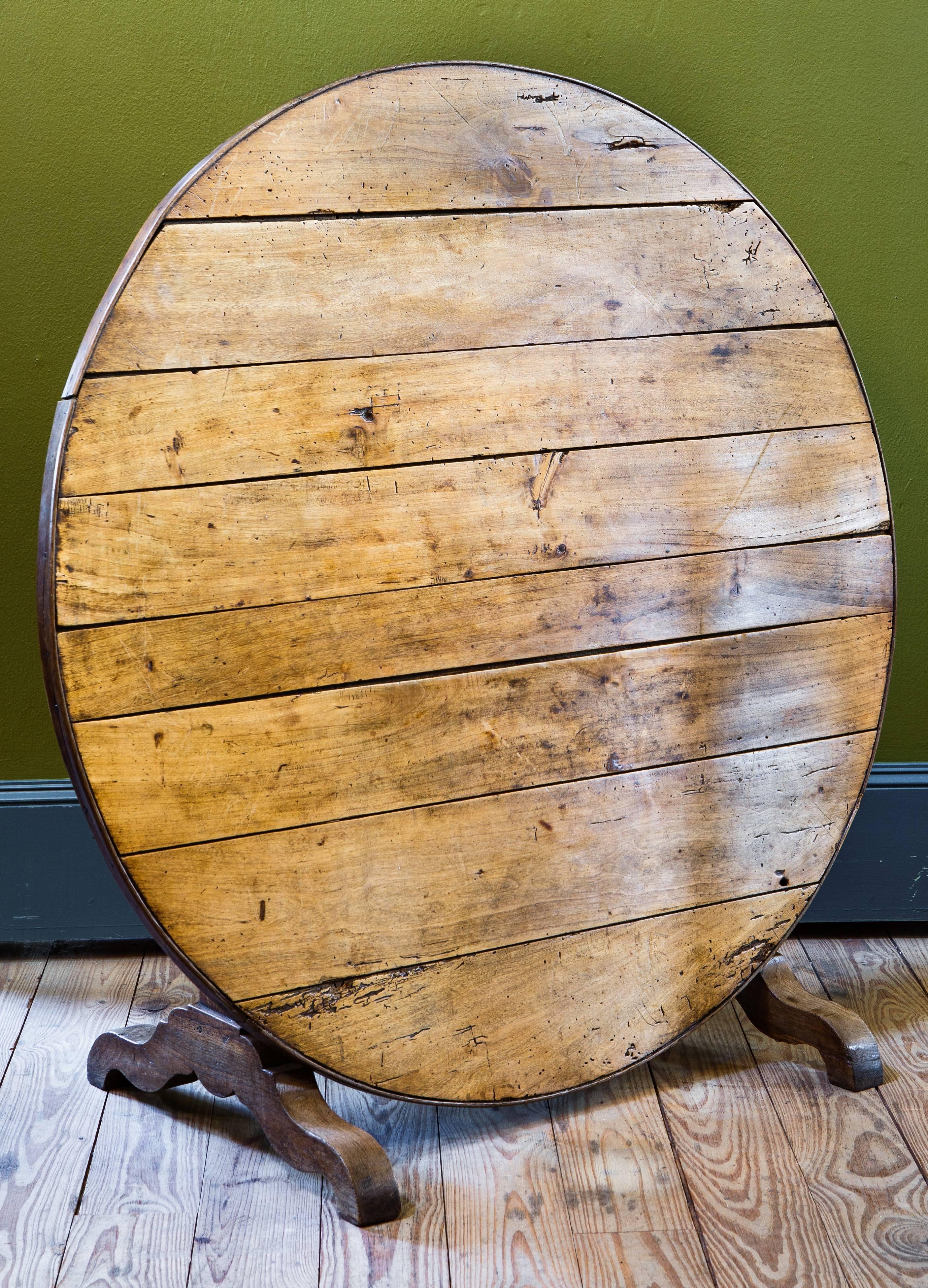 Vintage French tilt-top vendage table, circa 1860. Beautifully stunning patina and subtle wear. All original. Tilted or folded table height is 48.25 high.