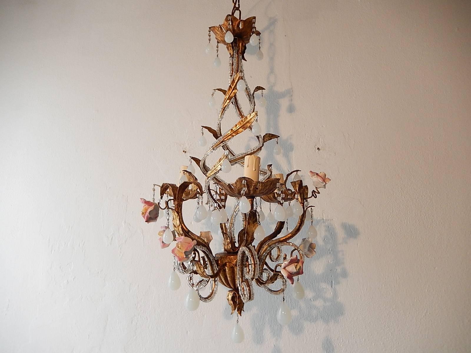 Housing three lights. Gilt tole beaded with crystal macaroni beads. Adorning handmade porcelain roses, all in great shape. Also, two sizes of rare white Murano opaline drops. Adding another 13 inches of original chain and canopy to this chandelier.