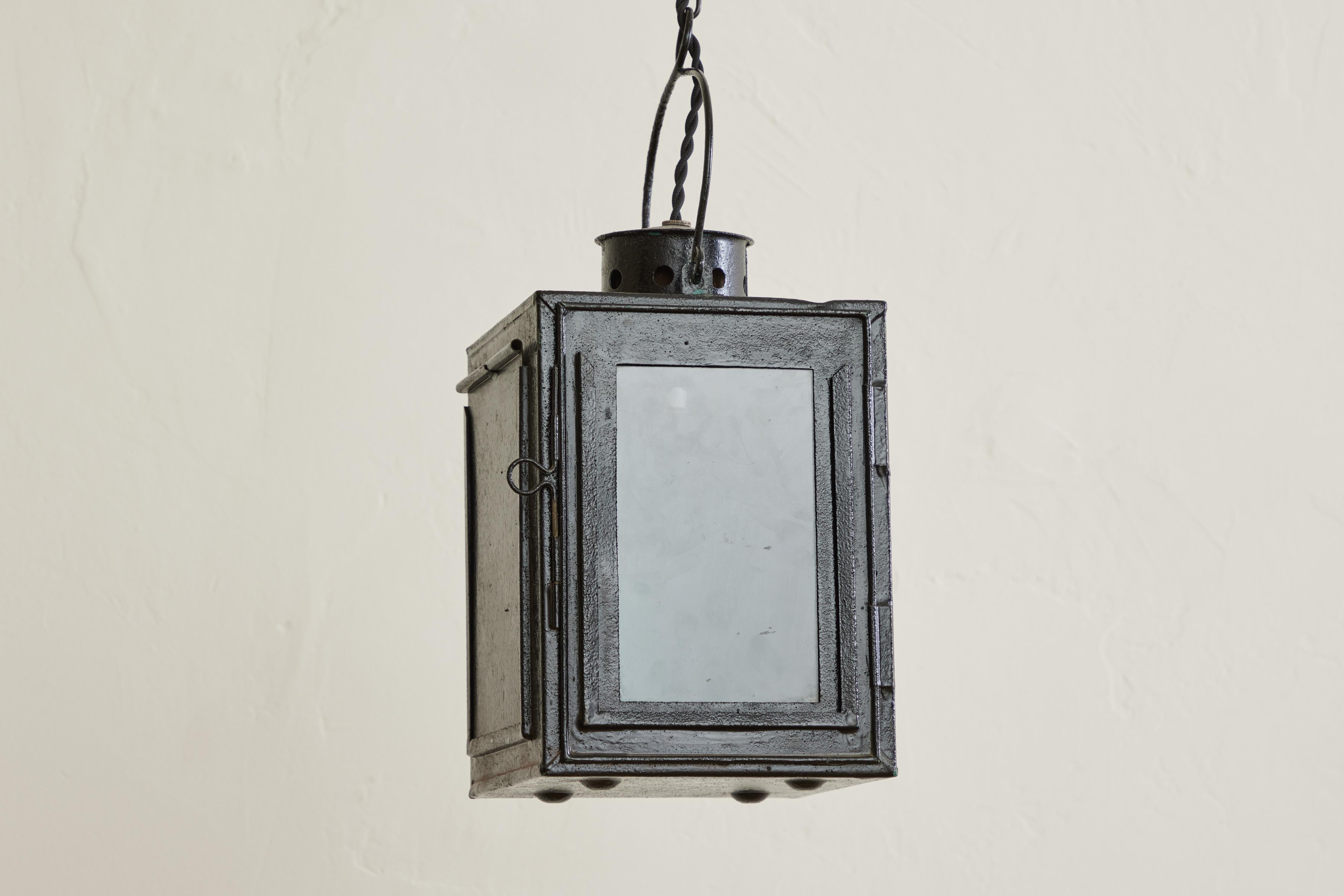 French tole lantern with a single glass panel. Blue metal interior and a punched tin top. Newly wired for hardwire installation. Wear throughout on original metal is consistent with age and use.