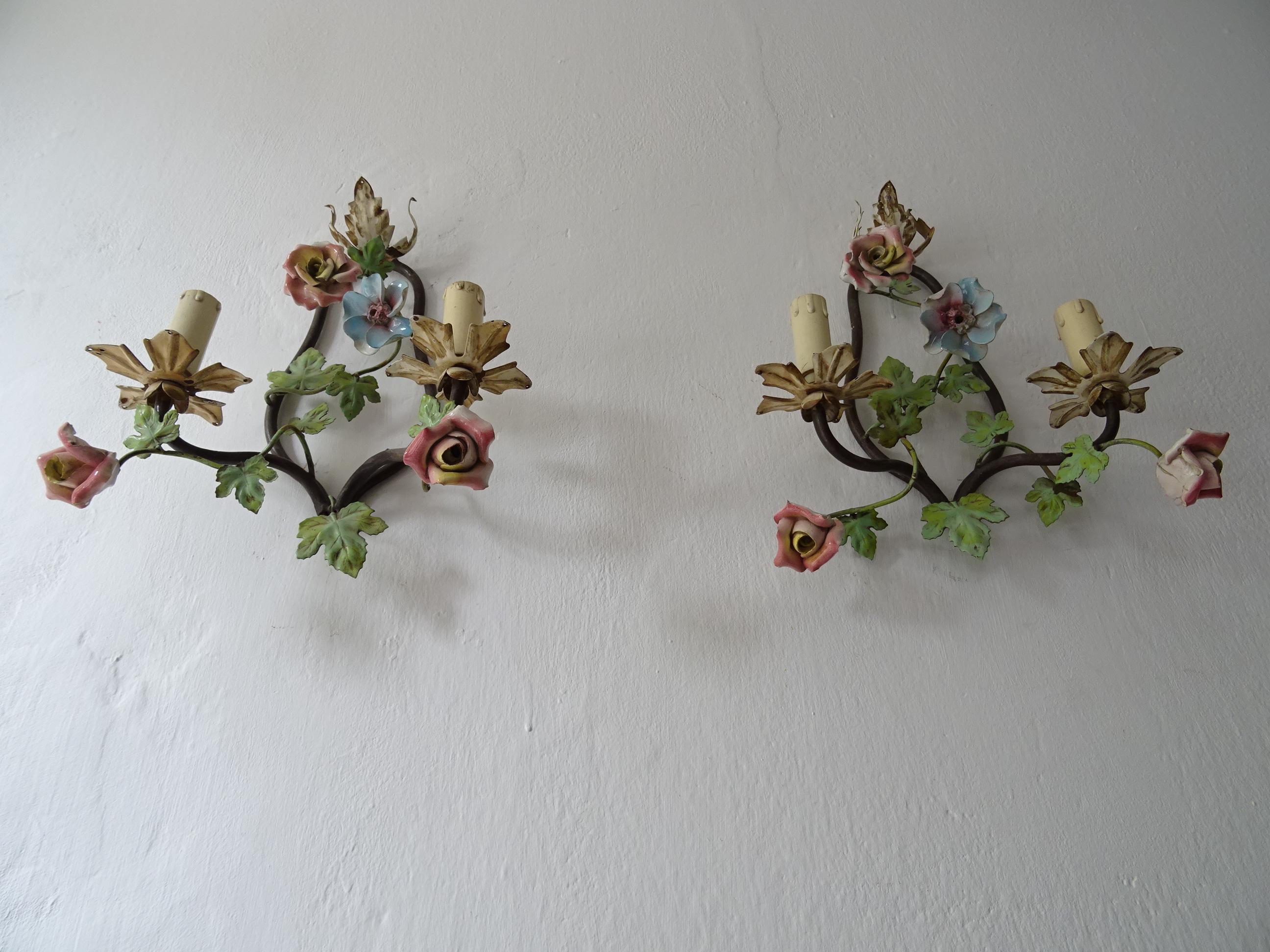 Housing two lights each. These will be rewired with certified US UL sockets for the USA and appropriate sockets for all other countries and ready to hang. Adorning 4 handmade porcelain flowers on each. 2 small grape leaves are missing. Free priority