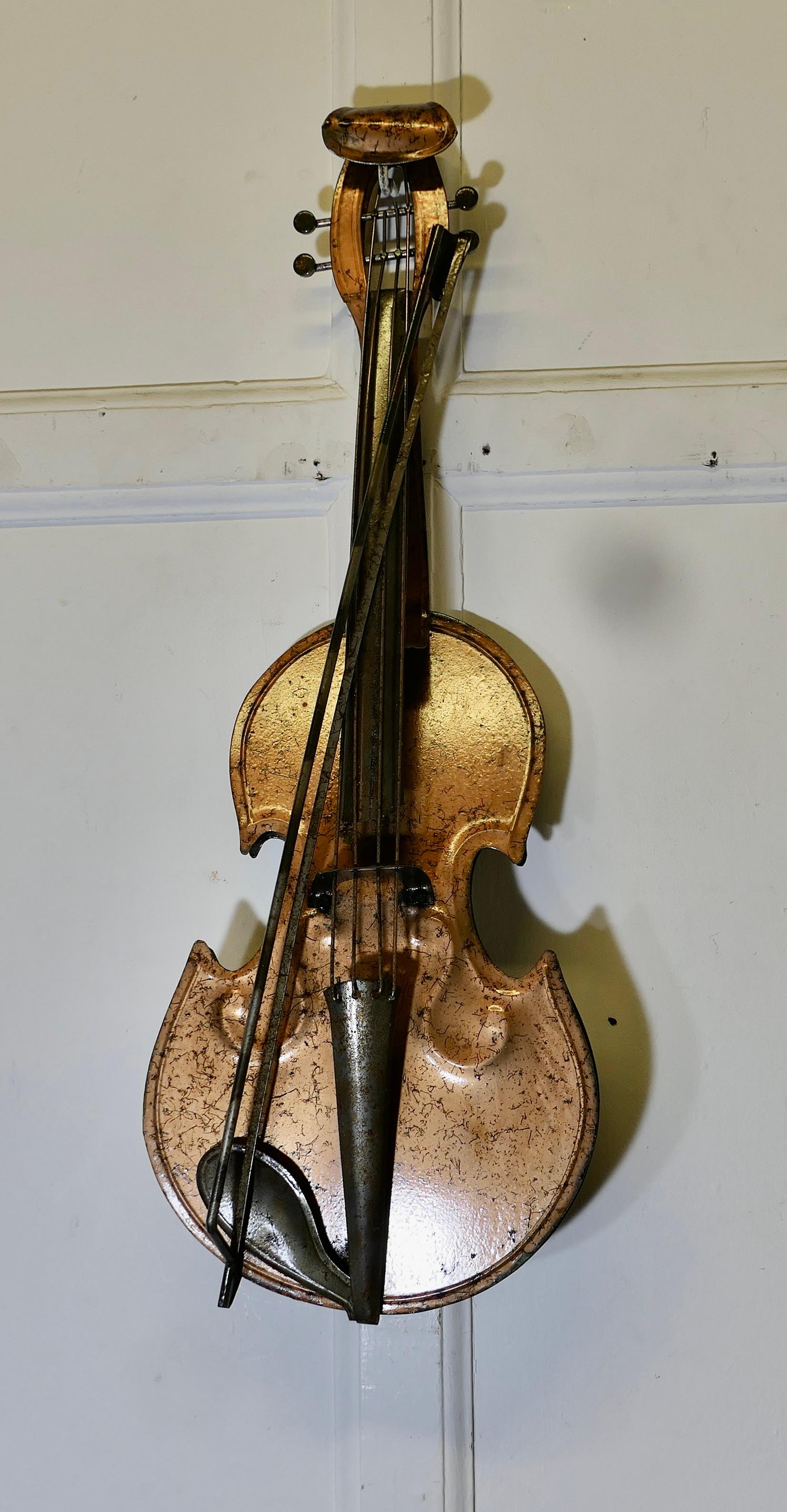 French Toleware Violin Maker’s Shop Trade Sign

This is a very rare piece it is in good condition and hangs on the wall in various positions
The Violin has been copied in clear detail, the body has a copper look finish which reflects well, it is in