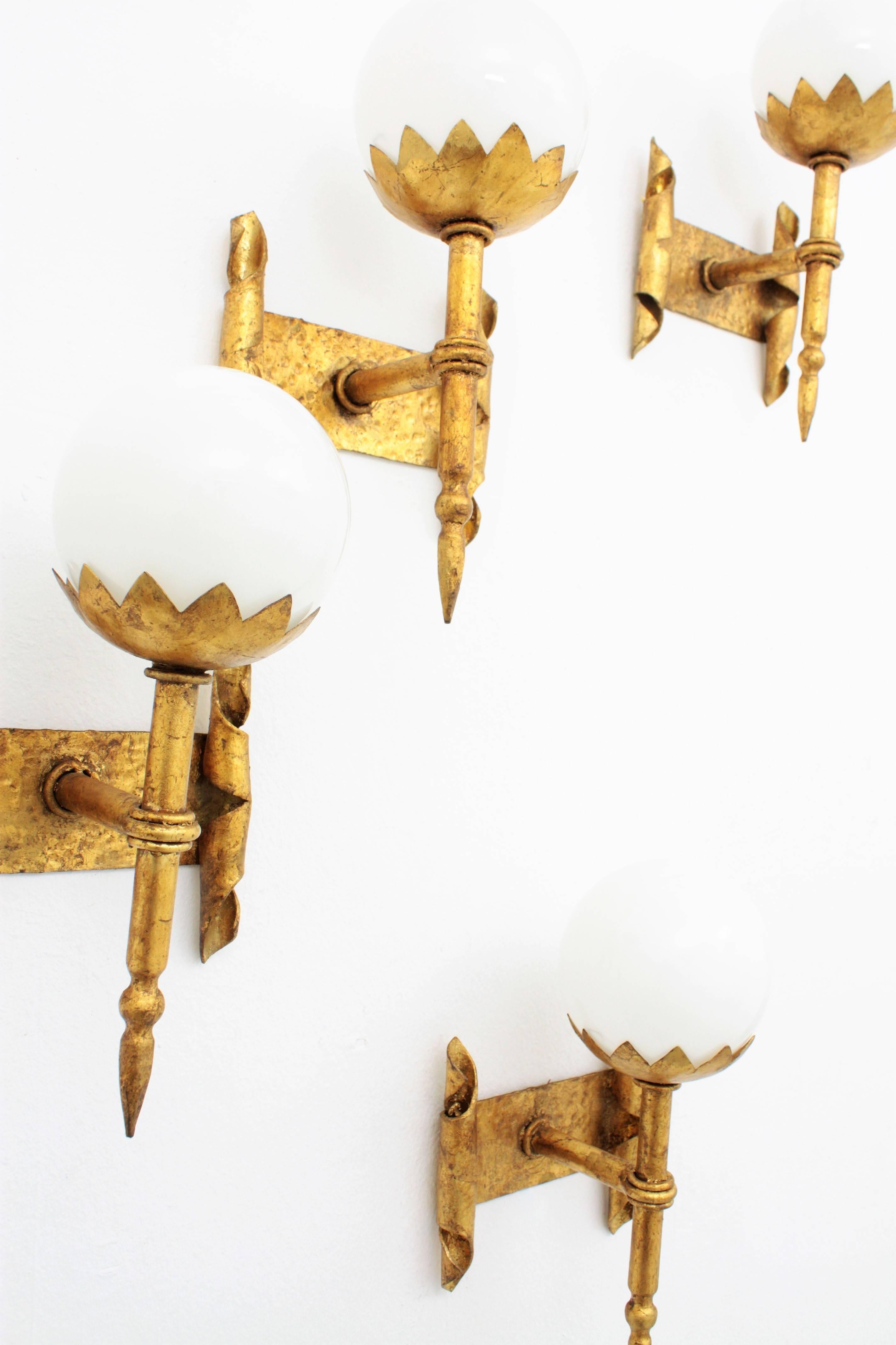 French Torch Globe Wall Lights in Wrought Gilt Iron and Milk Glass, Set of Four In Excellent Condition In Barcelona, ES