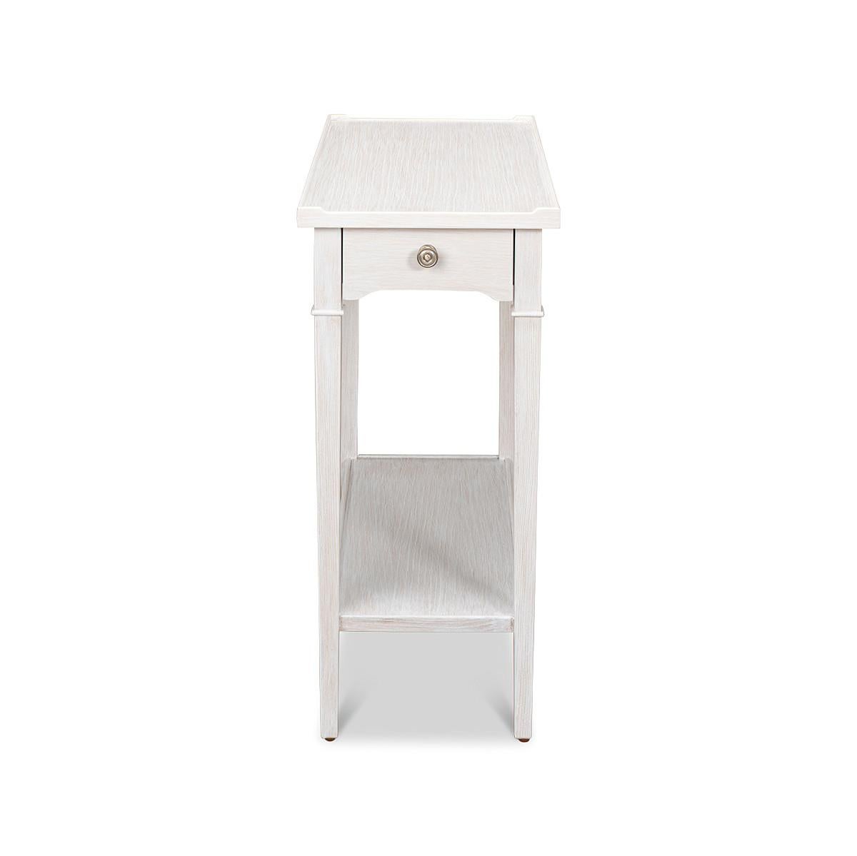 A French Traditional End table with a wooden gallery, two drawers, square tapered legs and a stretcher base in a painted whitewash finish.

Dimensions: 26