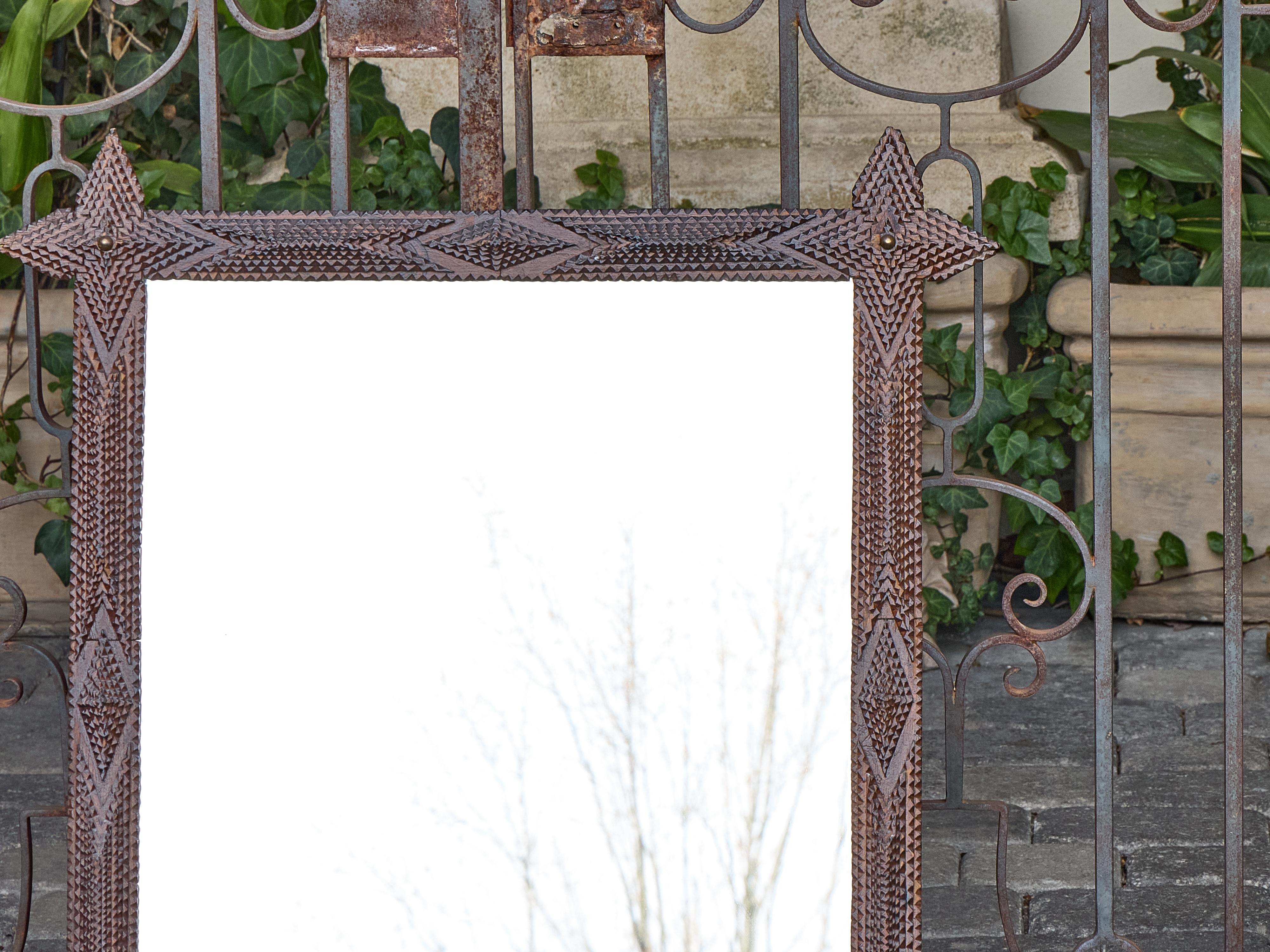 Hand-Carved French Tramp Art Mirror with Brass Accents and Protruding Finials, circa 1900