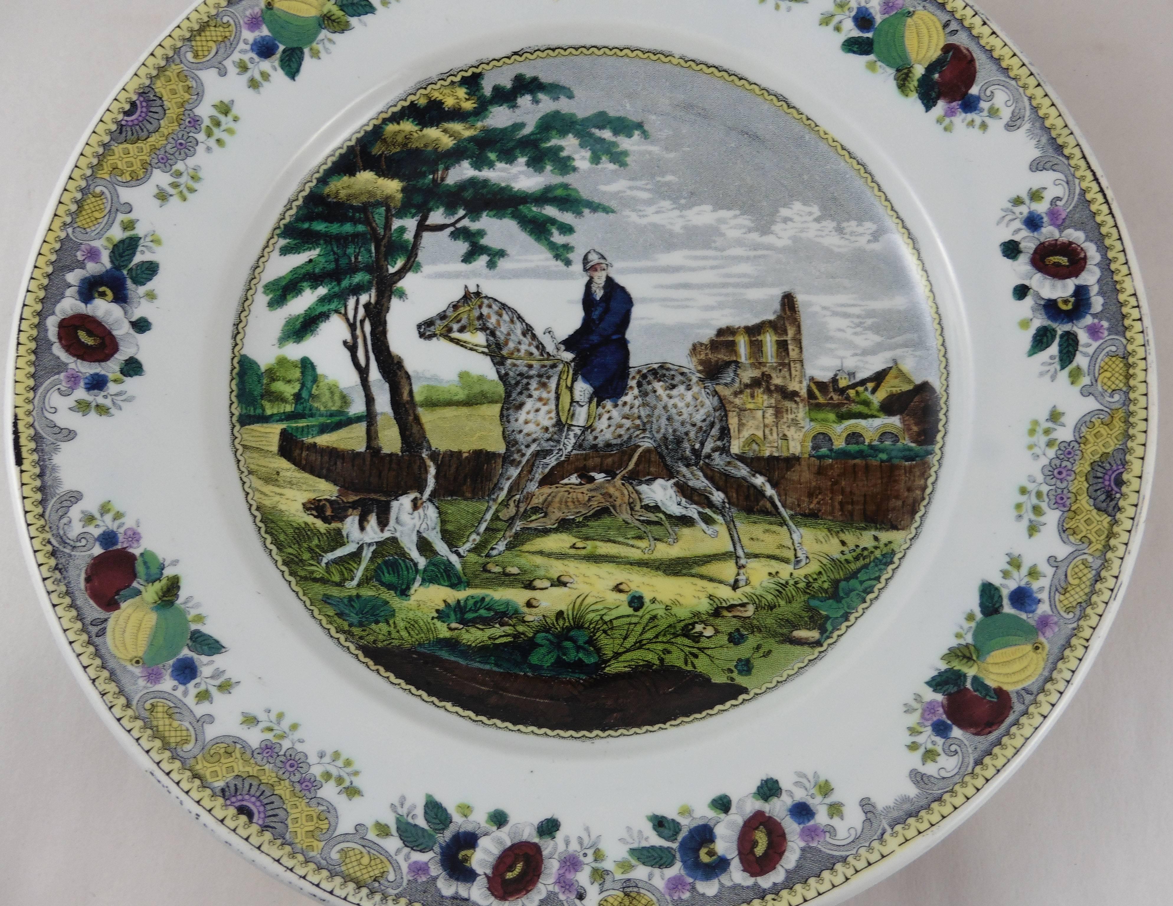 Early French polychrome transferware platter with hunt scene horseman and his dogs signed Hippolyte Boulenger for the manufacture of Choisy le roi, circa 1840.
The platter edges area is decorated with fruits and flowers.
   