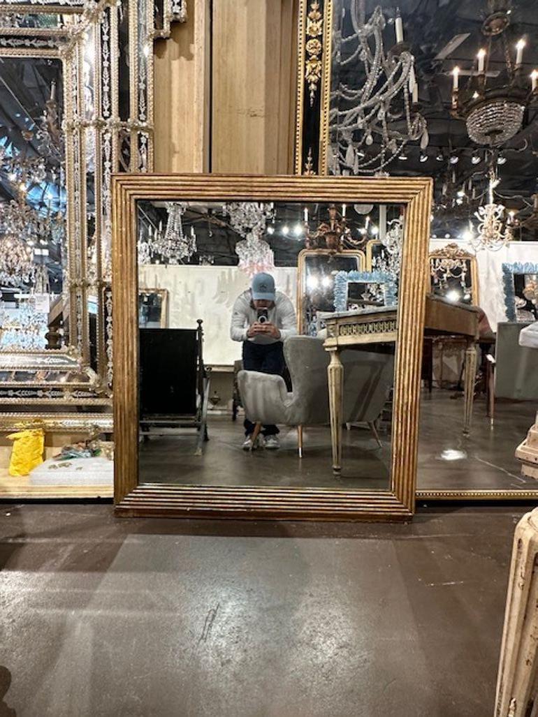 19th century French transitional square giltwood mirror. Circa 1870. A timeless and classic touch for a fine interior.