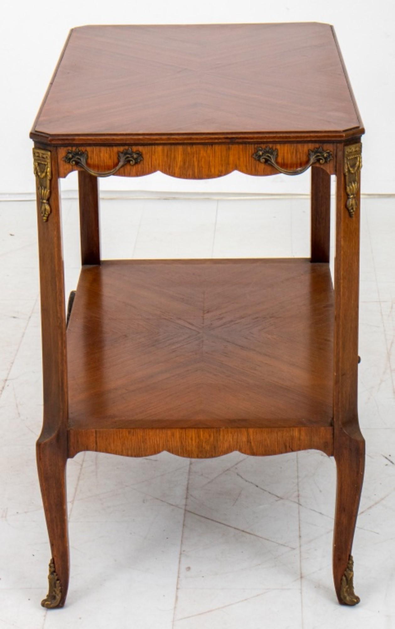 French transitional Louis XV / XVI style bar  cart in the manner of the Maison Jansen, the  bookmatched Macassar Ebony top above shaped  legs on wheels.

Dealer: S138XX