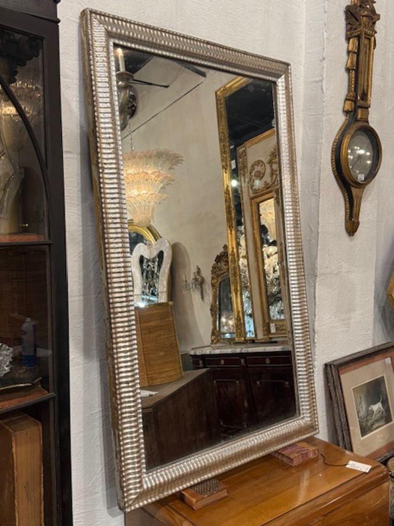 19th century French transitional silver leaf wave frame mirror. You're eyeing a true gem of 19th-century French design—a transitional silver leaf wave frame mirror blends the curvaceous elegance of Louis Philippe style with the cleaner lines that