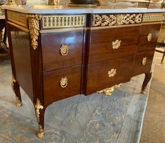 French Transitional-style mahogany and ormolu breakfront commode