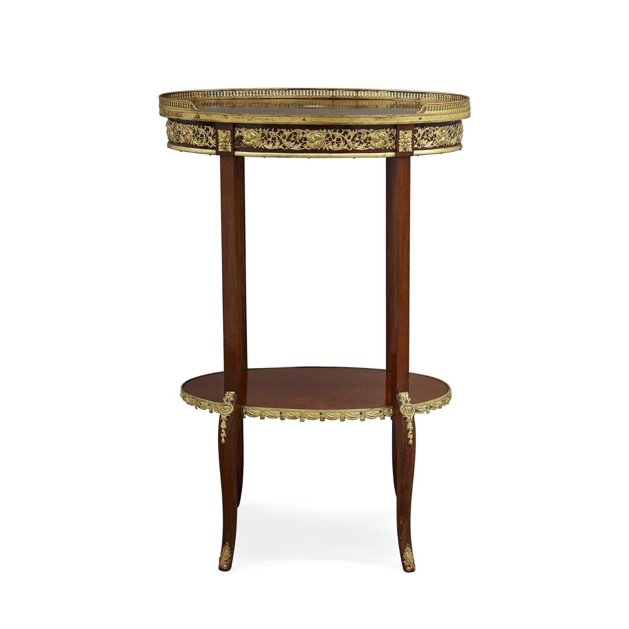 French Transitional style ormolu mounted wood étagère
French, late 19th century
Measures: Height 80cm, width 54cm, depth 37cm

This fine étagère—a shelved side table—is crafted in the Transitional style from mahogany and gilt bronze. The table