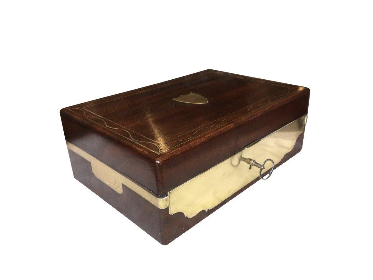 French Travel Necessaire, circa 1800, (“grand necessaire de voyage d’officier”), mahogany box, with multiple layers to the interior, holding pieces in sterling and crystal, all silver is hallmarked. Box marked Fait par MAIRE FT de Nécessaire, Rue