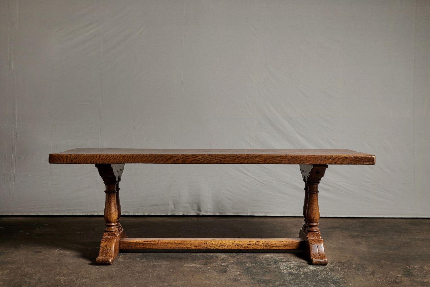 19th century style French oak dining table with a single oak plank top.