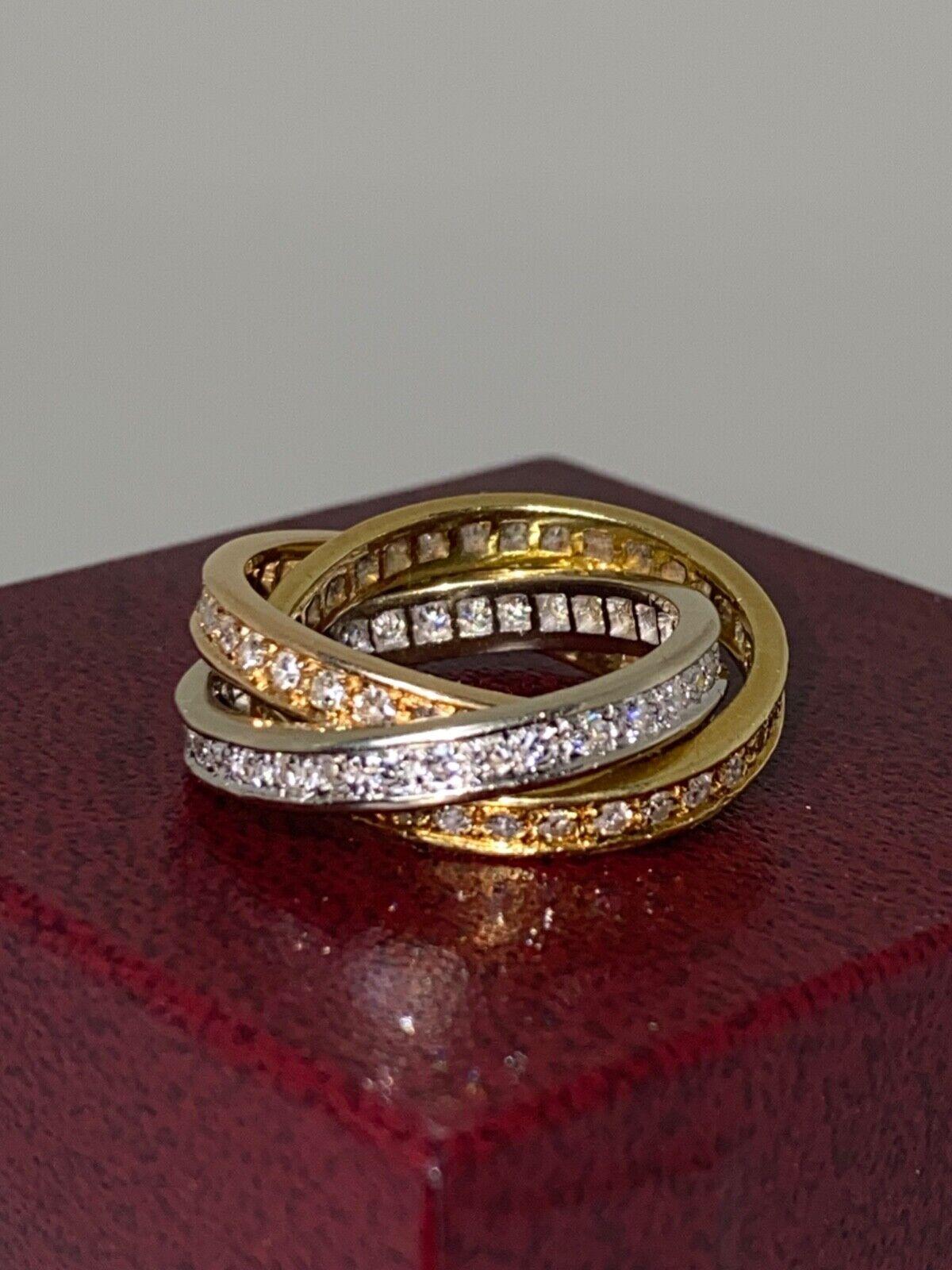 Iconically designed as Cartier style Russian wedders, 
exquisitely crafted in 18K tri-coloured gold (white, yellow & rose), 
this Trinity Ring is handmade in France 
(bearing French hallmark)

Each band is an eternity band - which is not only highly