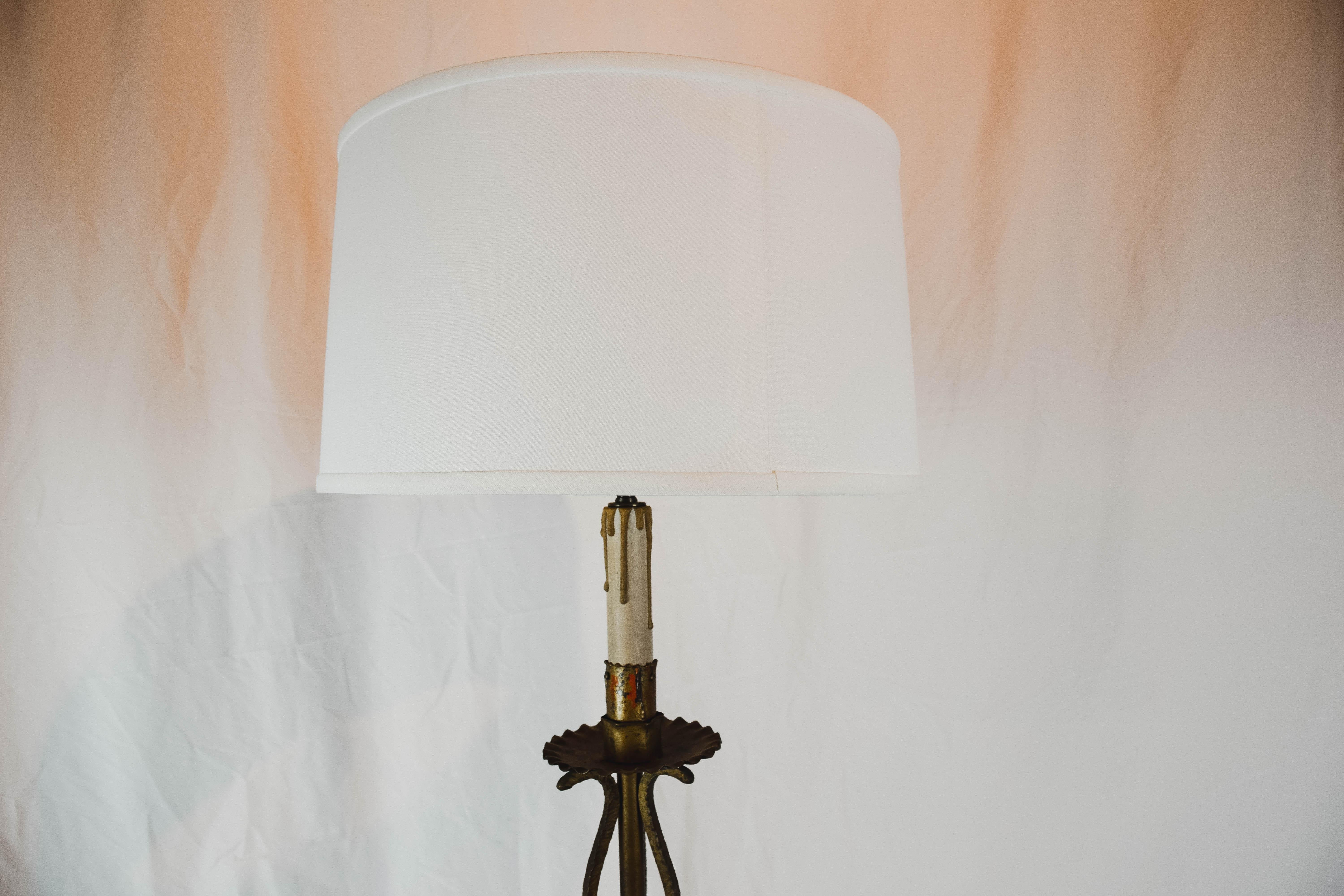 French tripod candlestick table lamp with a faux candlestick. Drum shade is 15