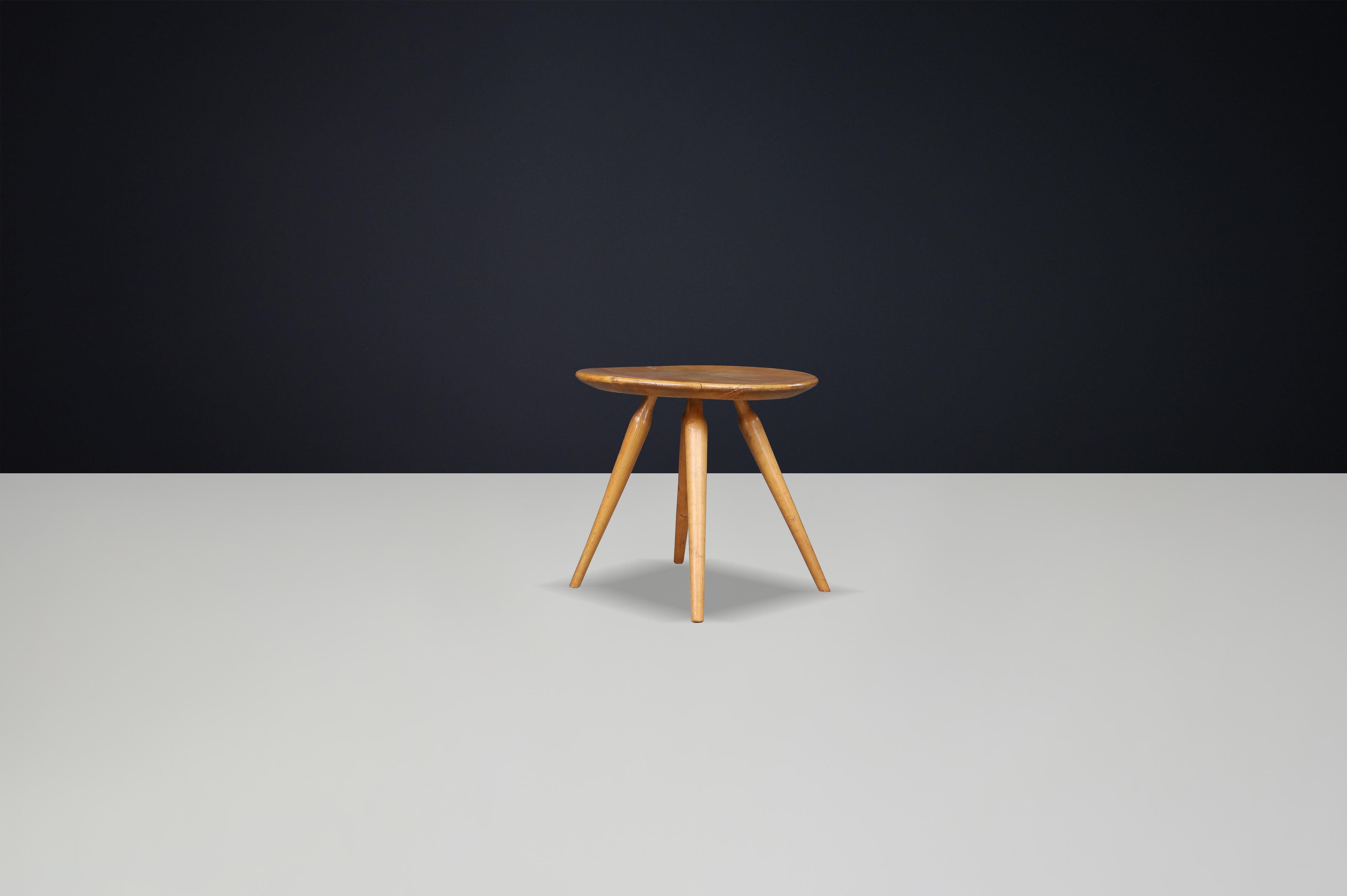 French Side Table in Ash, 1950s

A charming and sculptural side table crafted in France during the 1950s. This piece embodies the quiet elegance and functional simplicity that defined mid-century French rural design. Made from solid ash wood, the