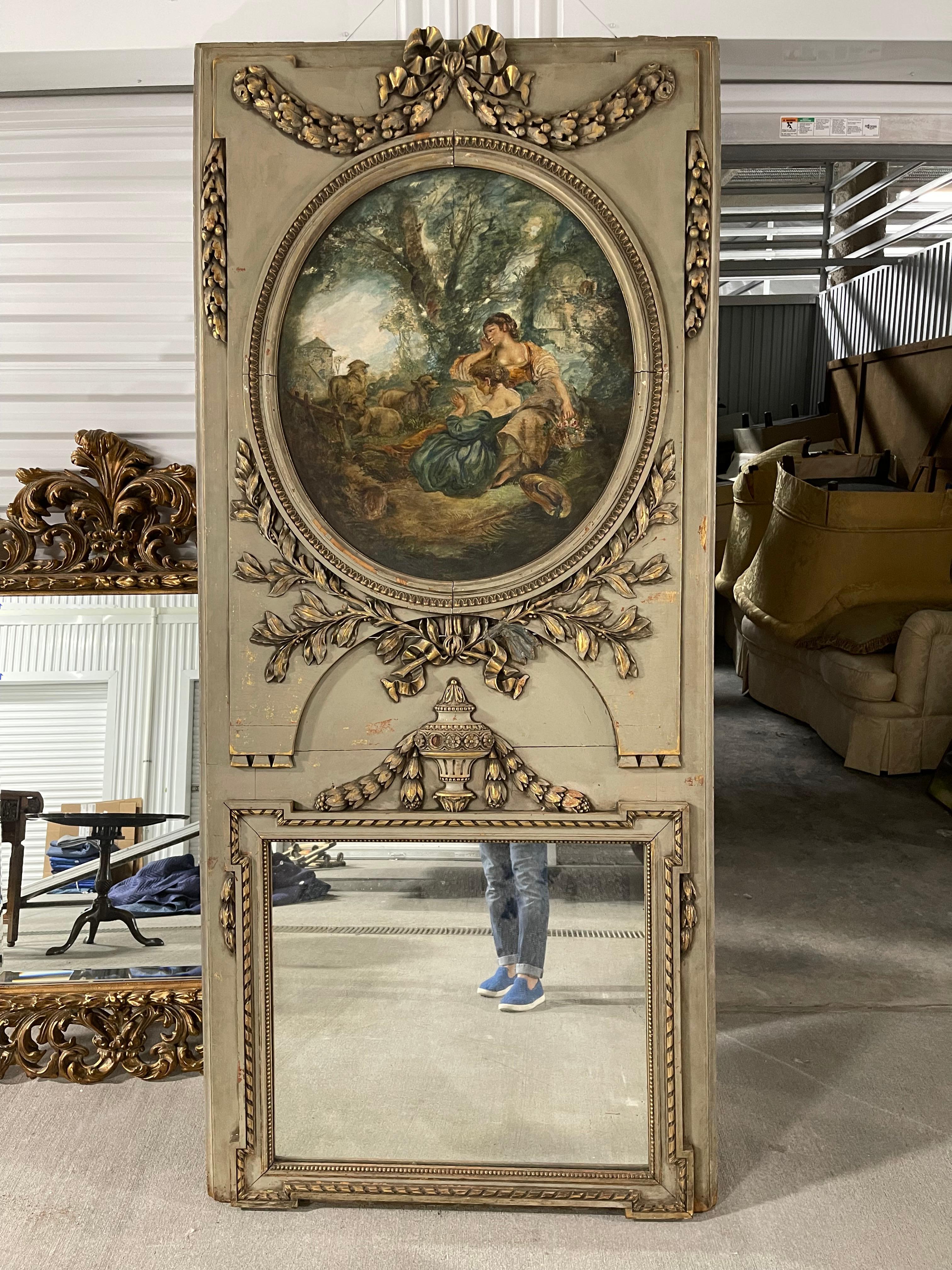 19th century French Trumeau green and gold mirror with a painted scene of ladies with and sheep. Original mercury mirror.