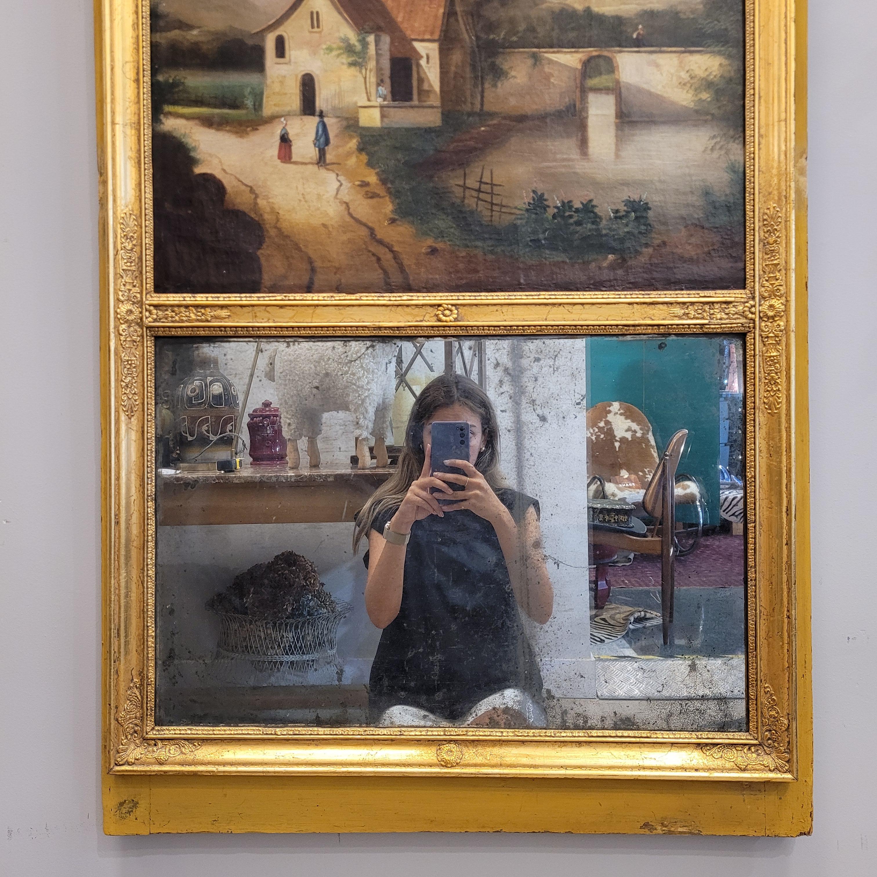 Late 18th Century French trumeau mirror and baroque painting in a gilded frame