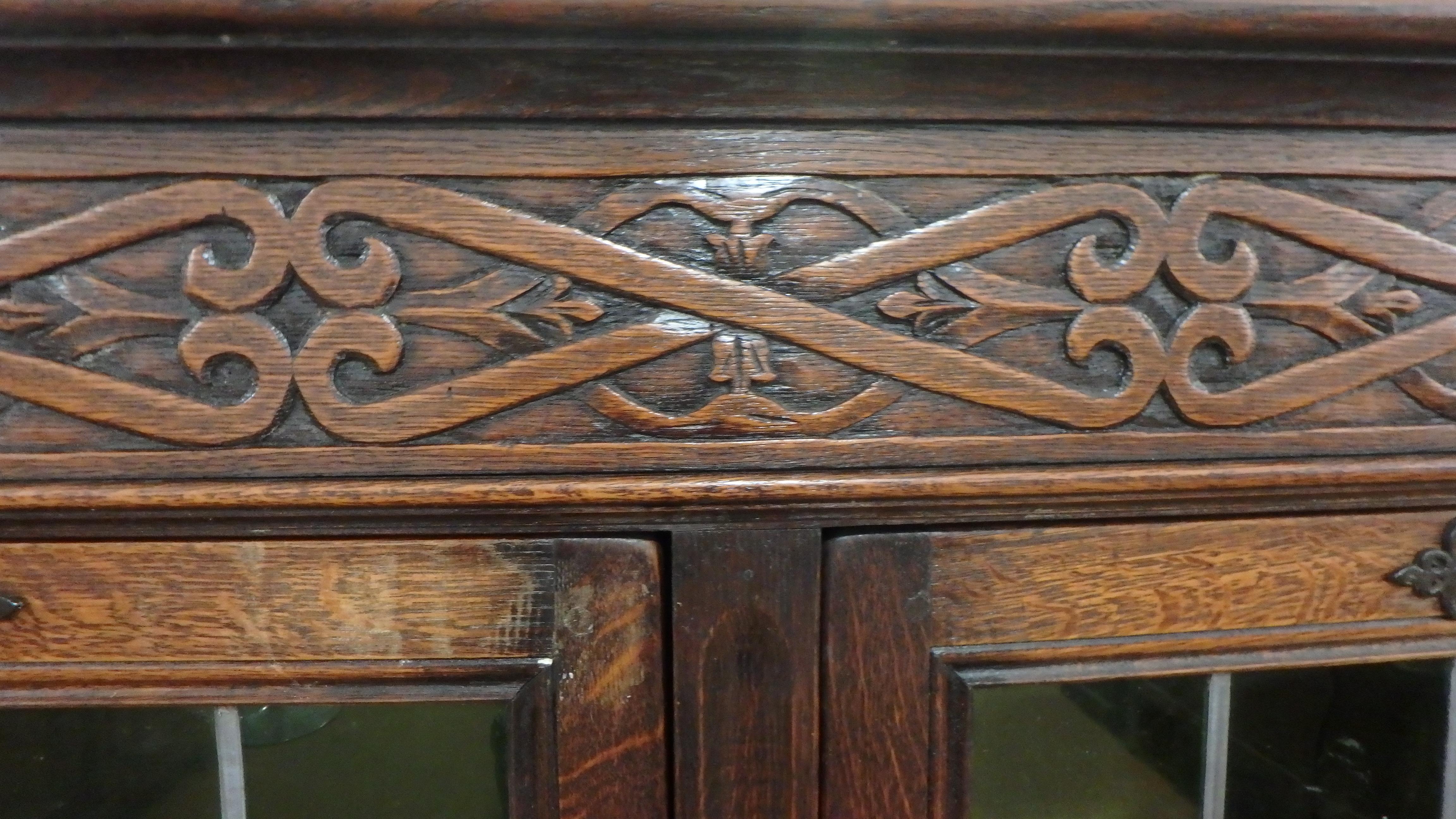 French Tudor Bookcase Cabinet 1900 Deep Hand Carving with Leaded Glass Doors In Good Condition For Sale In Clinton, AR