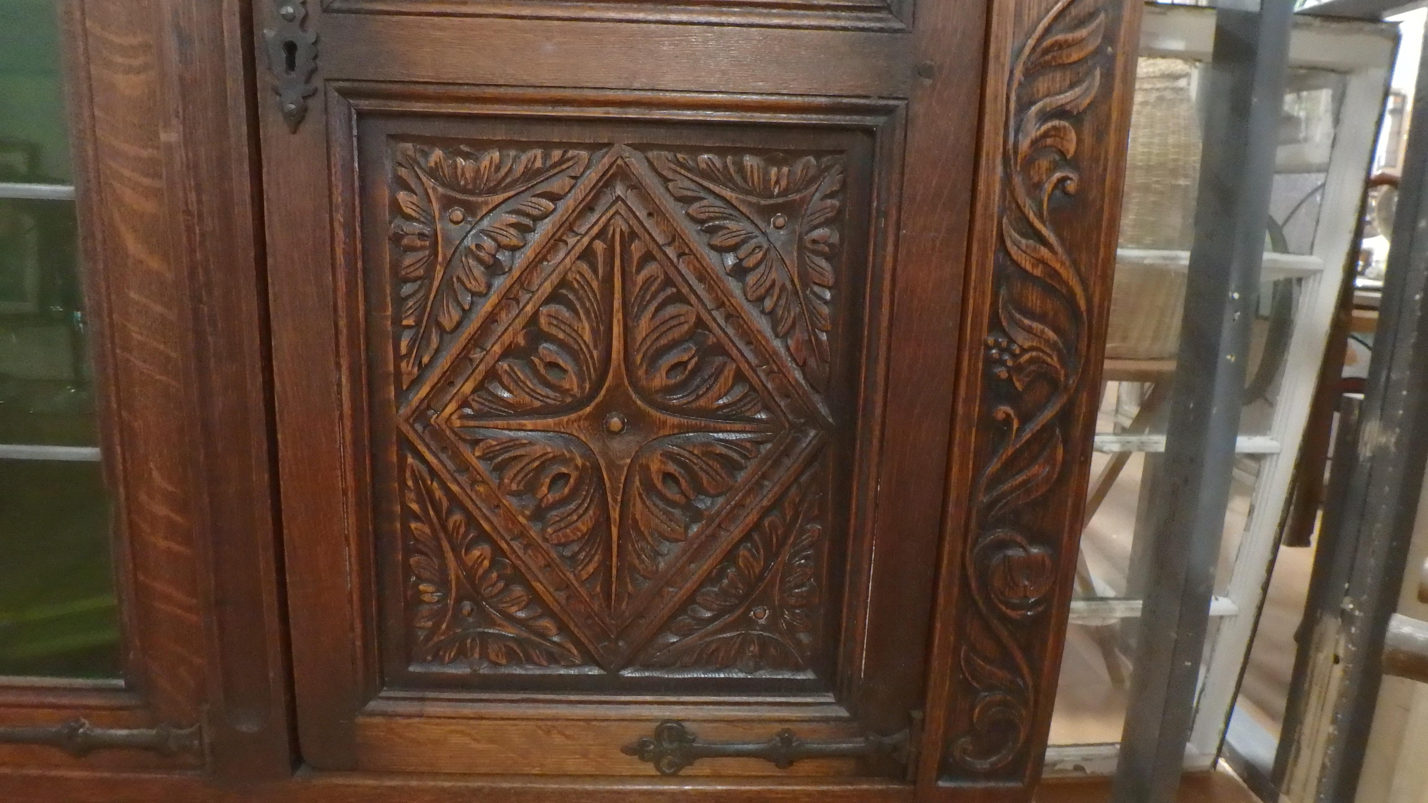 20th Century French Tudor Bookcase Cabinet 1900 Deep Hand Carving with Leaded Glass Doors For Sale