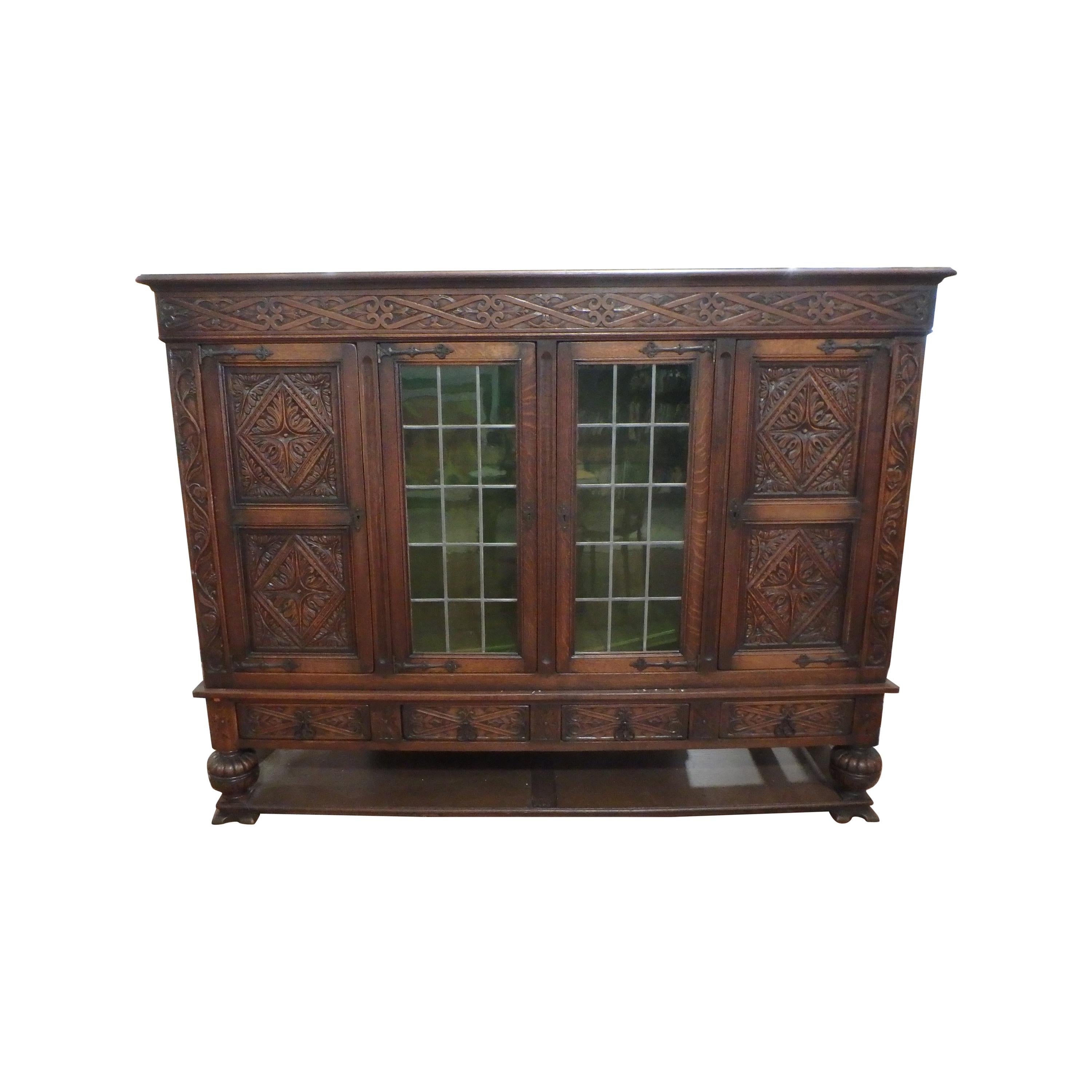 French Tudor Bookcase Cabinet 1900 Deep Hand Carving with Leaded Glass Doors For Sale