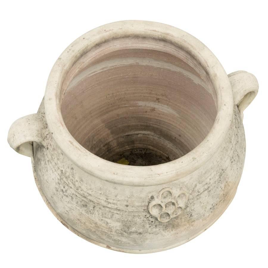 Bisque terracotta planter with decorative etchings, handles and drain hole.