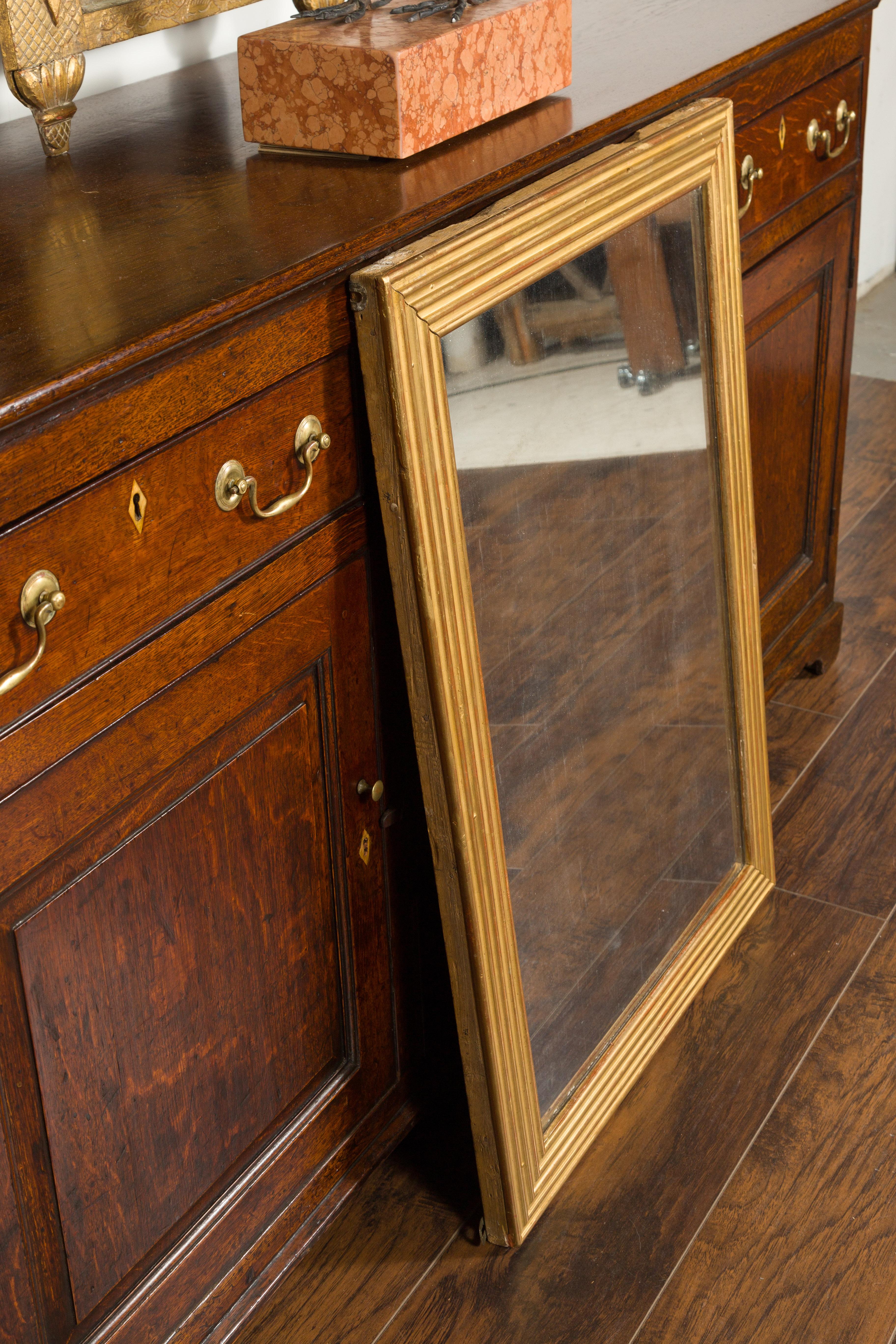French Turn of the Century Giltwood Mirror with Reeded Frame and Red Undertone 3