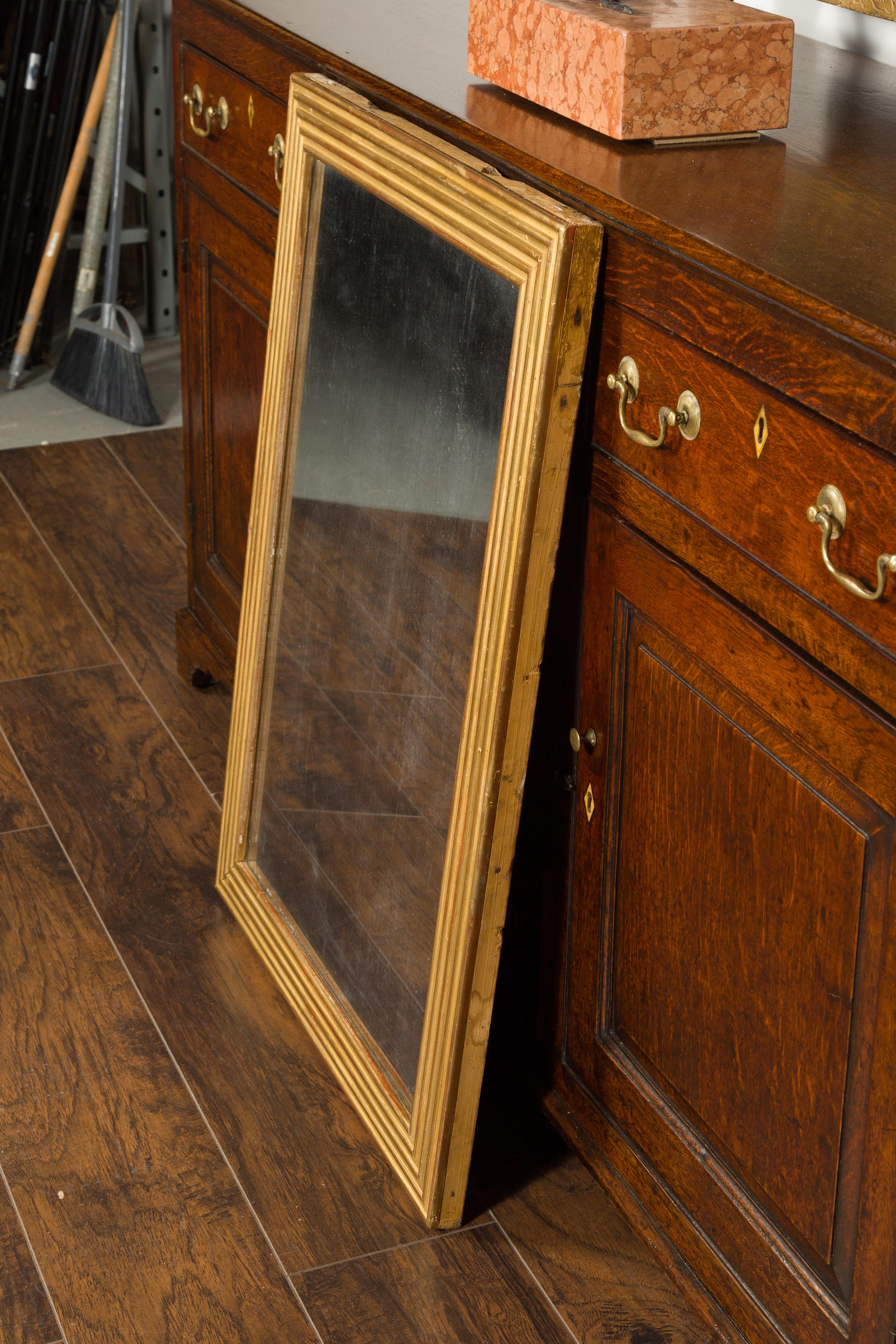 French Turn of the Century Giltwood Mirror with Reeded Frame and Red Undertone 4