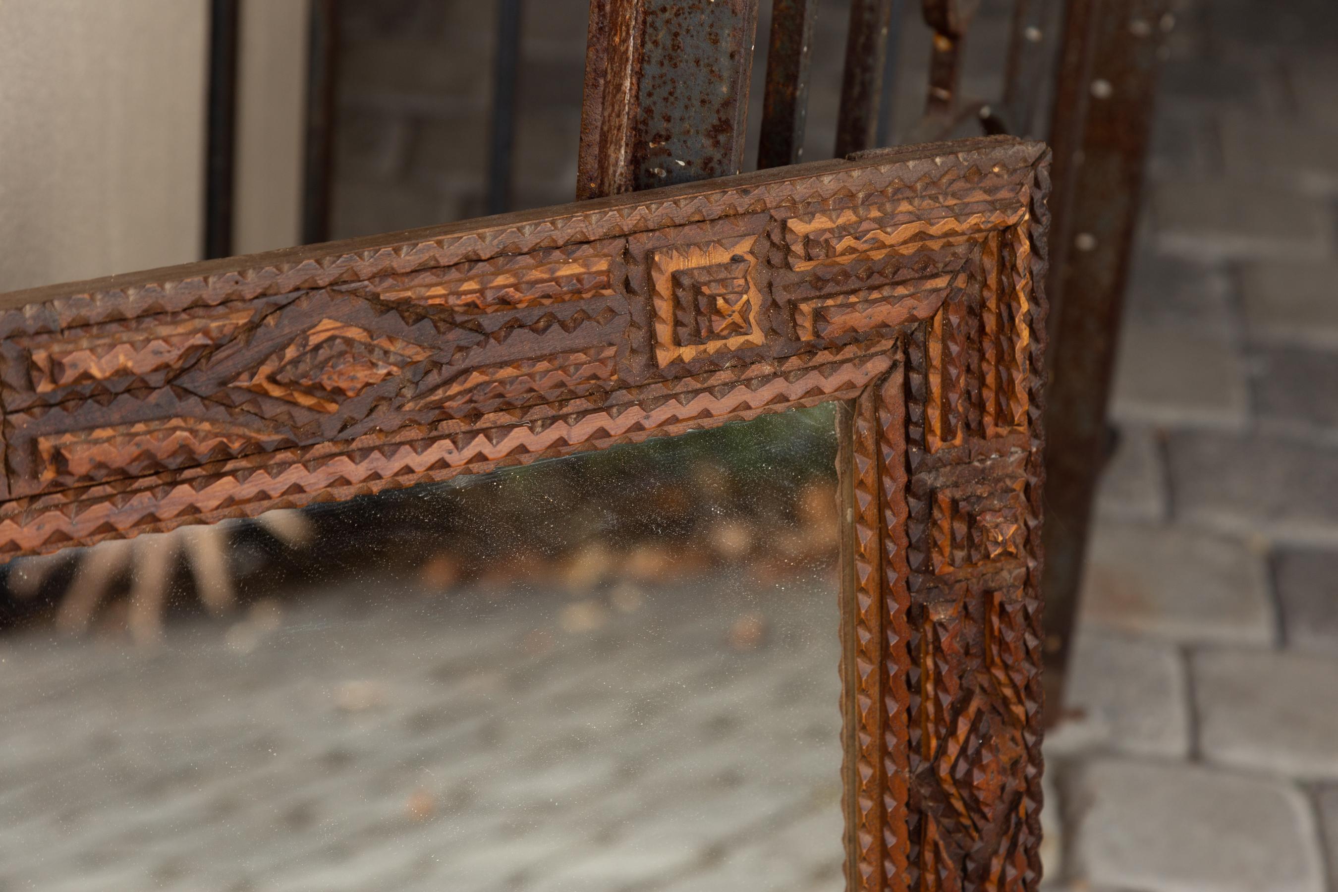 French Turn of the Century Hand Carved Tramp Art Folk Mirror with Raised Motifs In Good Condition In Atlanta, GA