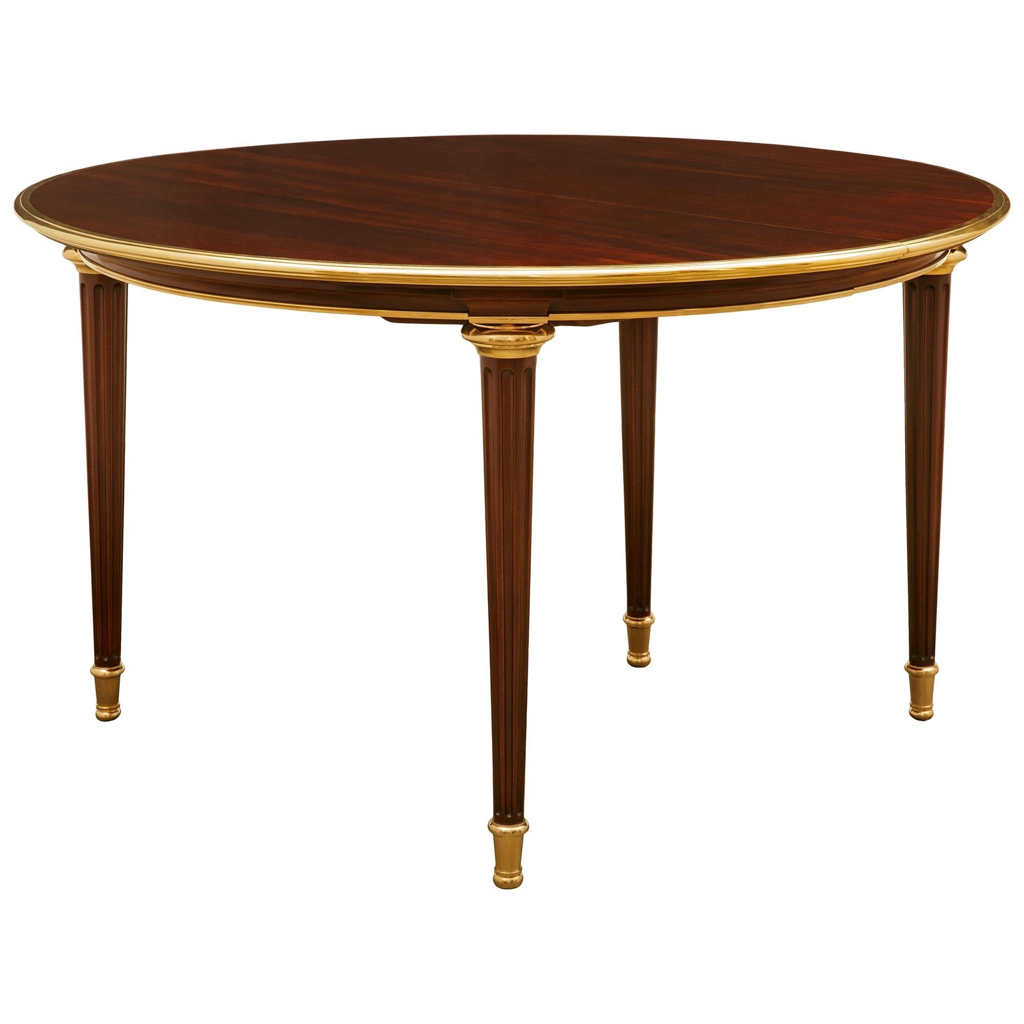 19th Century French Turn of the Century Louis XVI st. Mahogany and Ormolu dining table For Sale